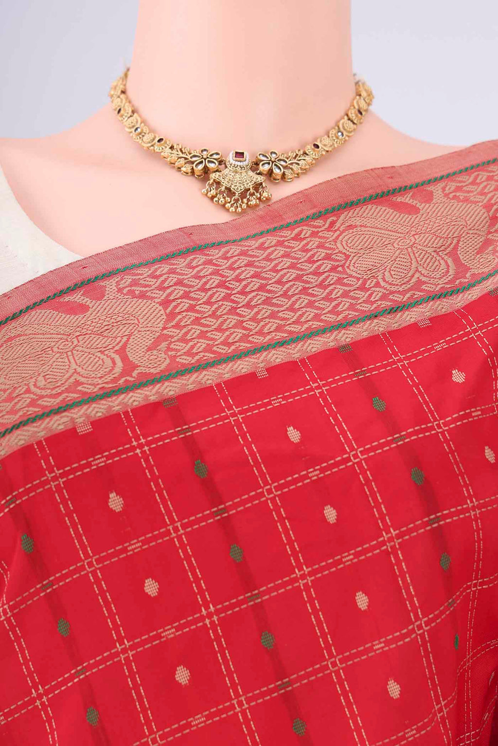 Border image of Red Blended Poly Cotton Saree with Checked design on the body and Thread Border. 