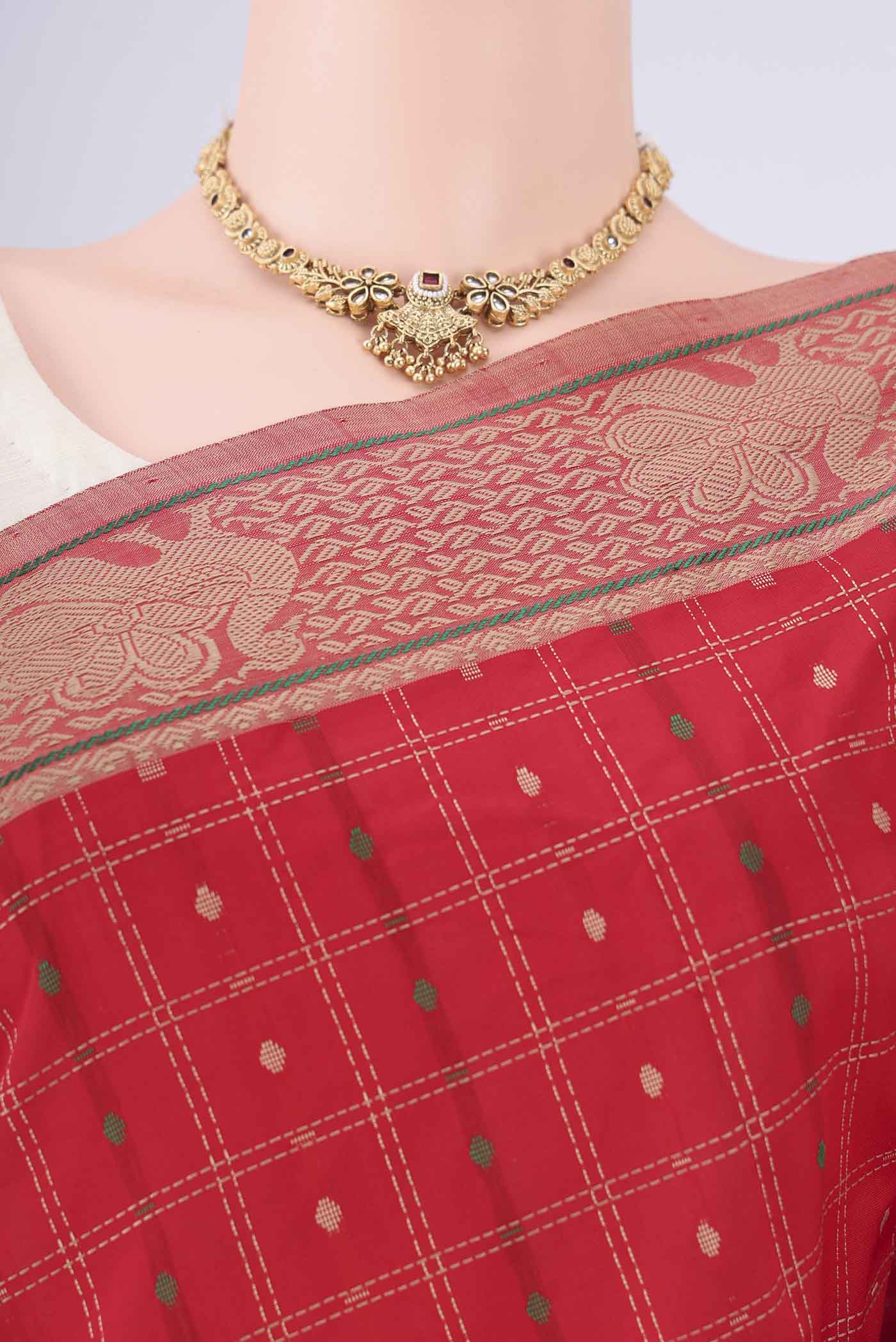 Border image of Red Blended Poly Cotton Saree with Checked design on the body and Thread Border. 