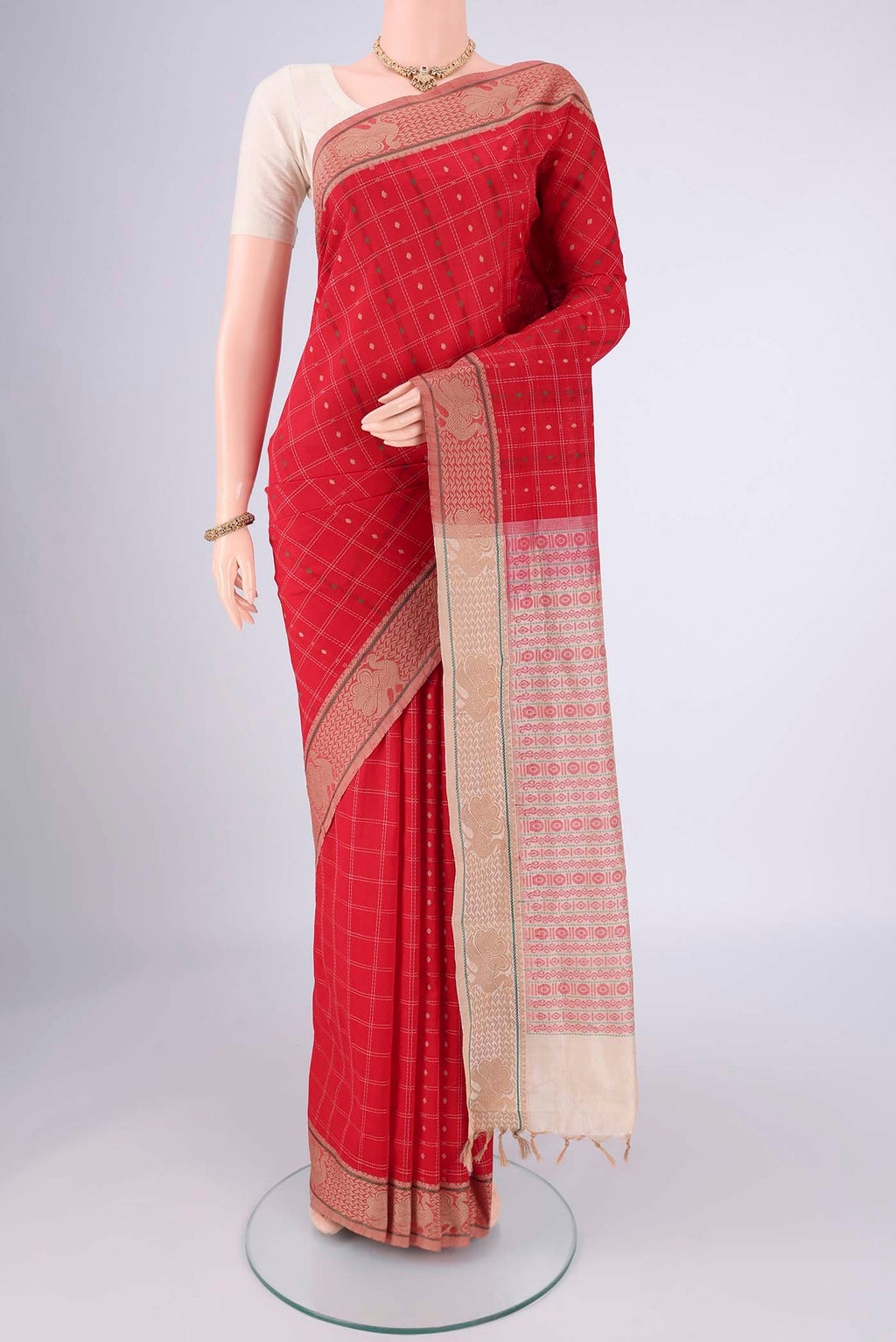 Red Blended Poly Cotton Saree with Checked design on the body and Thread Border.  displayed on a mannequin