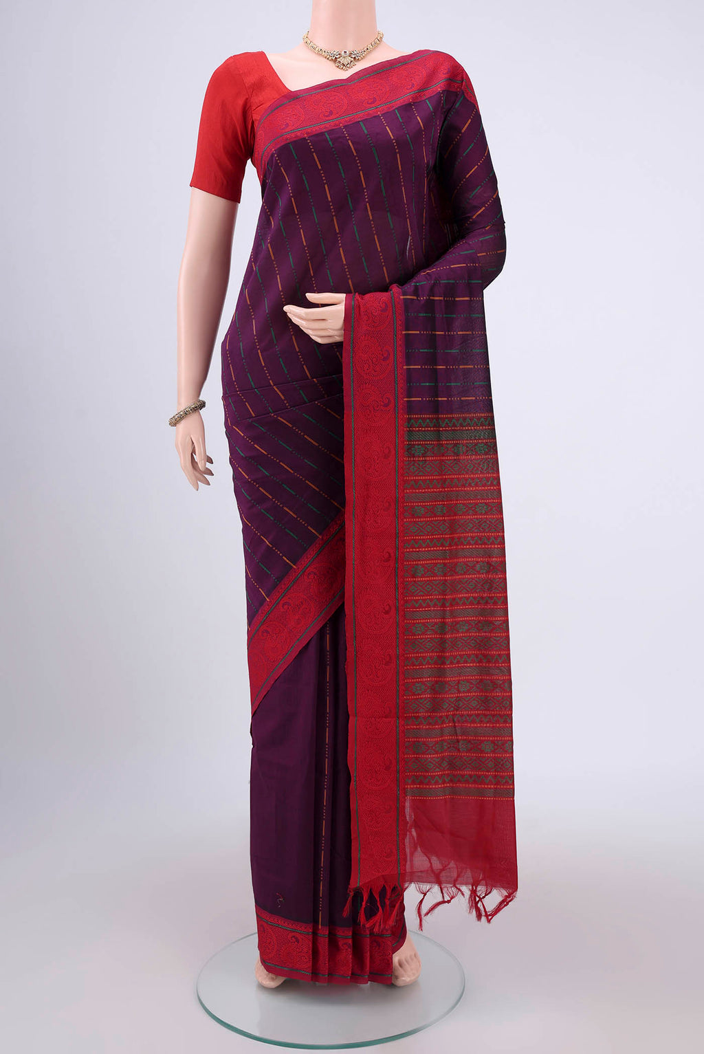 Purple Blended Poly Cotton Saree with Stripes on the body and Thread Border.  displayed on a mannequin