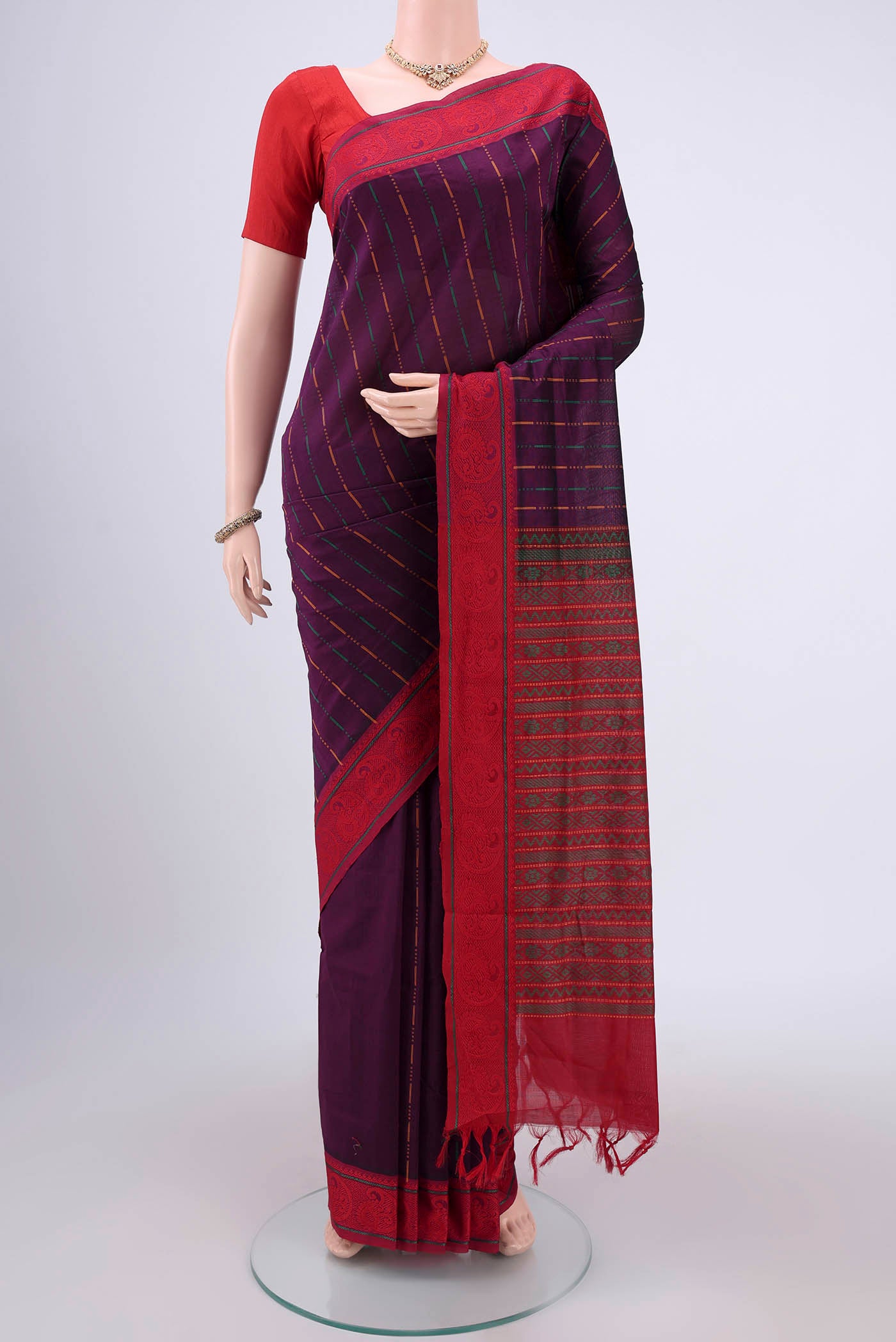 Purple Blended Poly Cotton Saree with Stripes on the body and Thread Border.  displayed on a mannequin