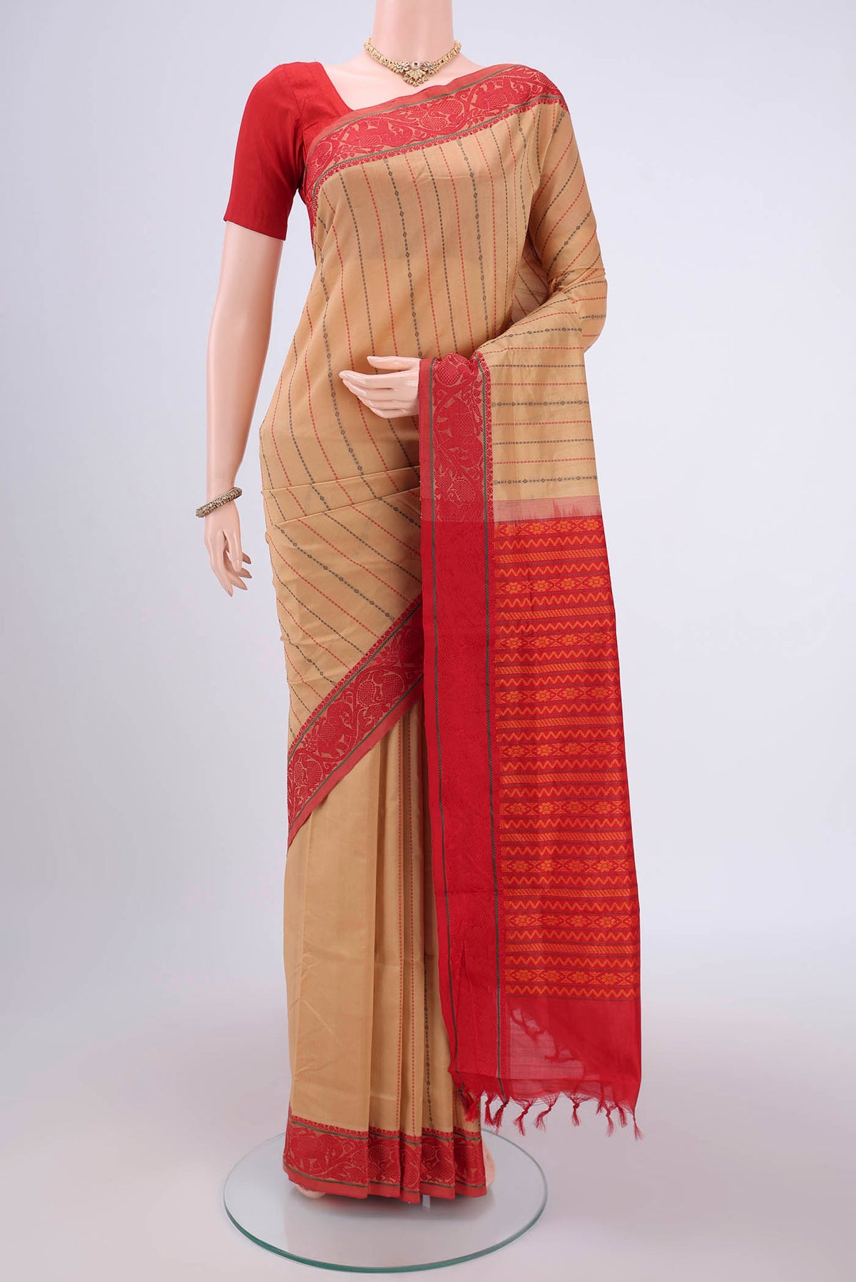 Beige Blended Poly Cotton Saree with Stripes on the body and Thread Border.  displayed on a mannequin