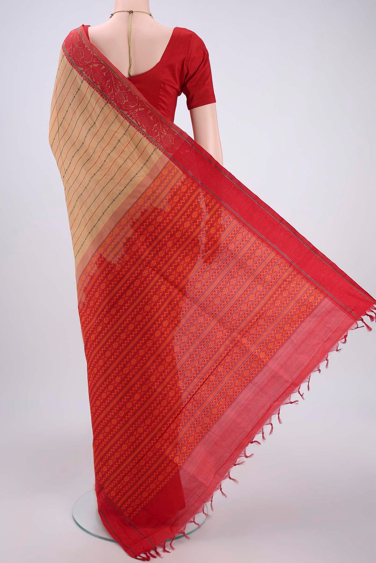 Flat view of Beige Blended Poly Cotton Saree with Stripes on the body and Thread Border. 