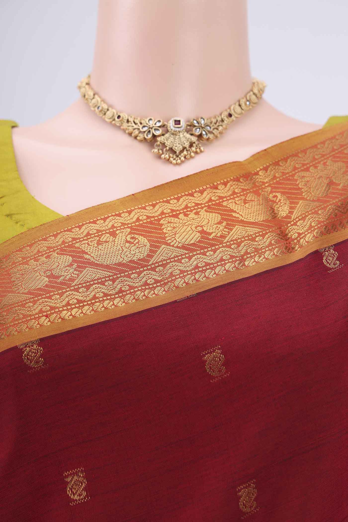 Border image of Red Blended Poly Cotton Saree with Zari Butta on the body and Zari Border. 