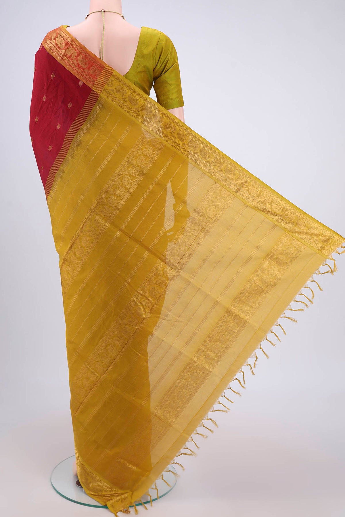Flat view of Red Blended Poly Cotton Saree with Zari Butta on the body and Zari Border. 