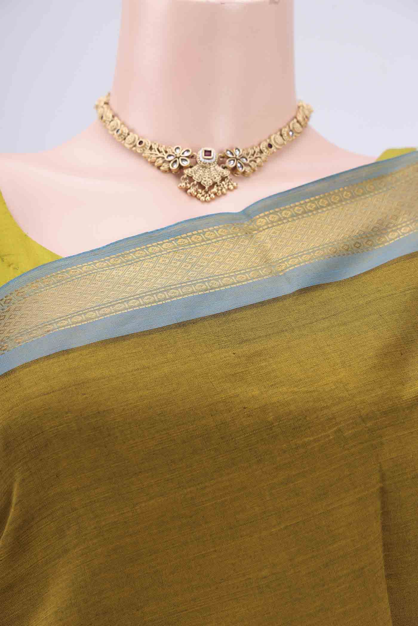 Border image of Blue Blended Poly Cotton Saree with Zari Butta on the body and Zari Border. 