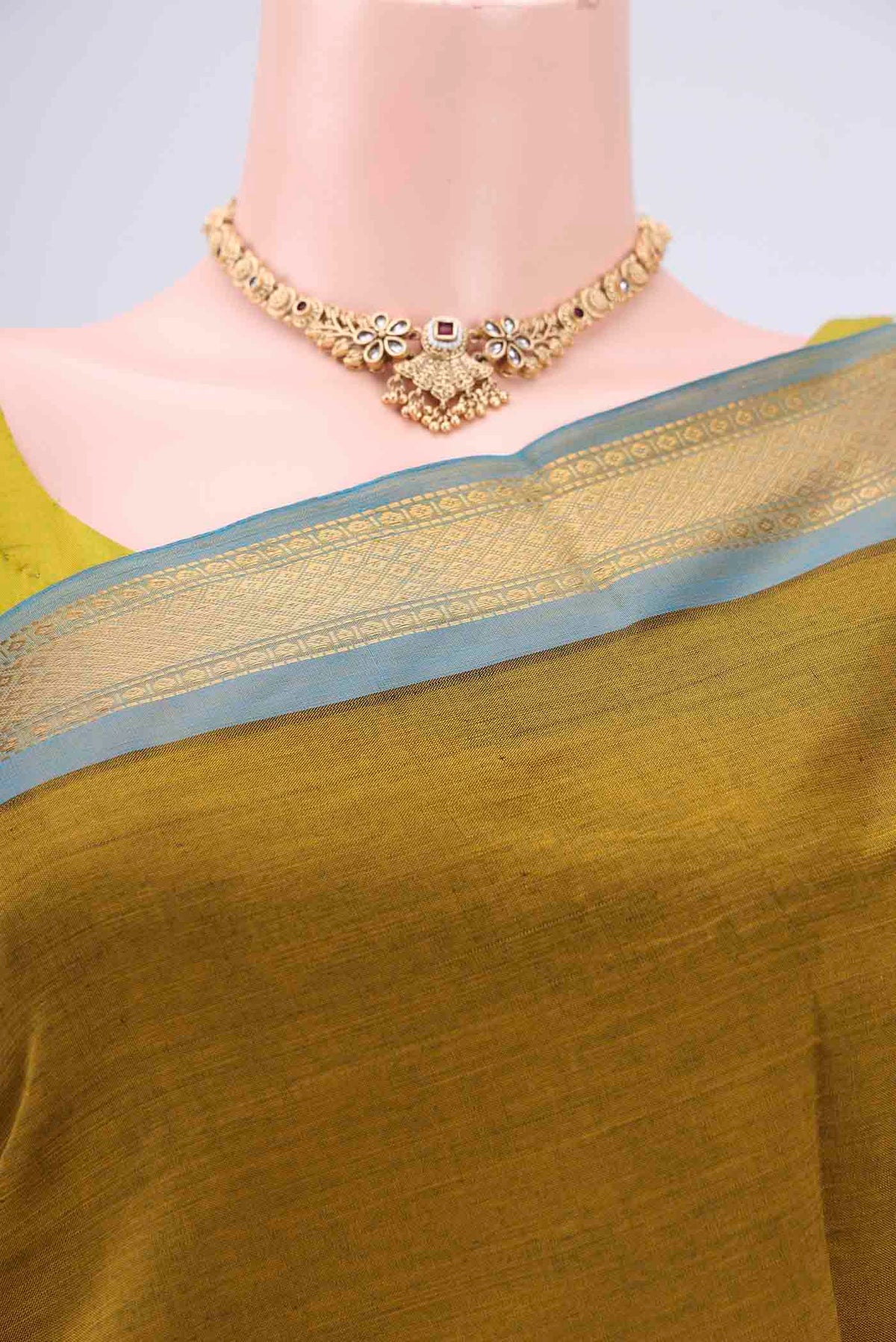 Border image of Blue Blended Poly Cotton Saree with Zari Butta on the body and Zari Border. 