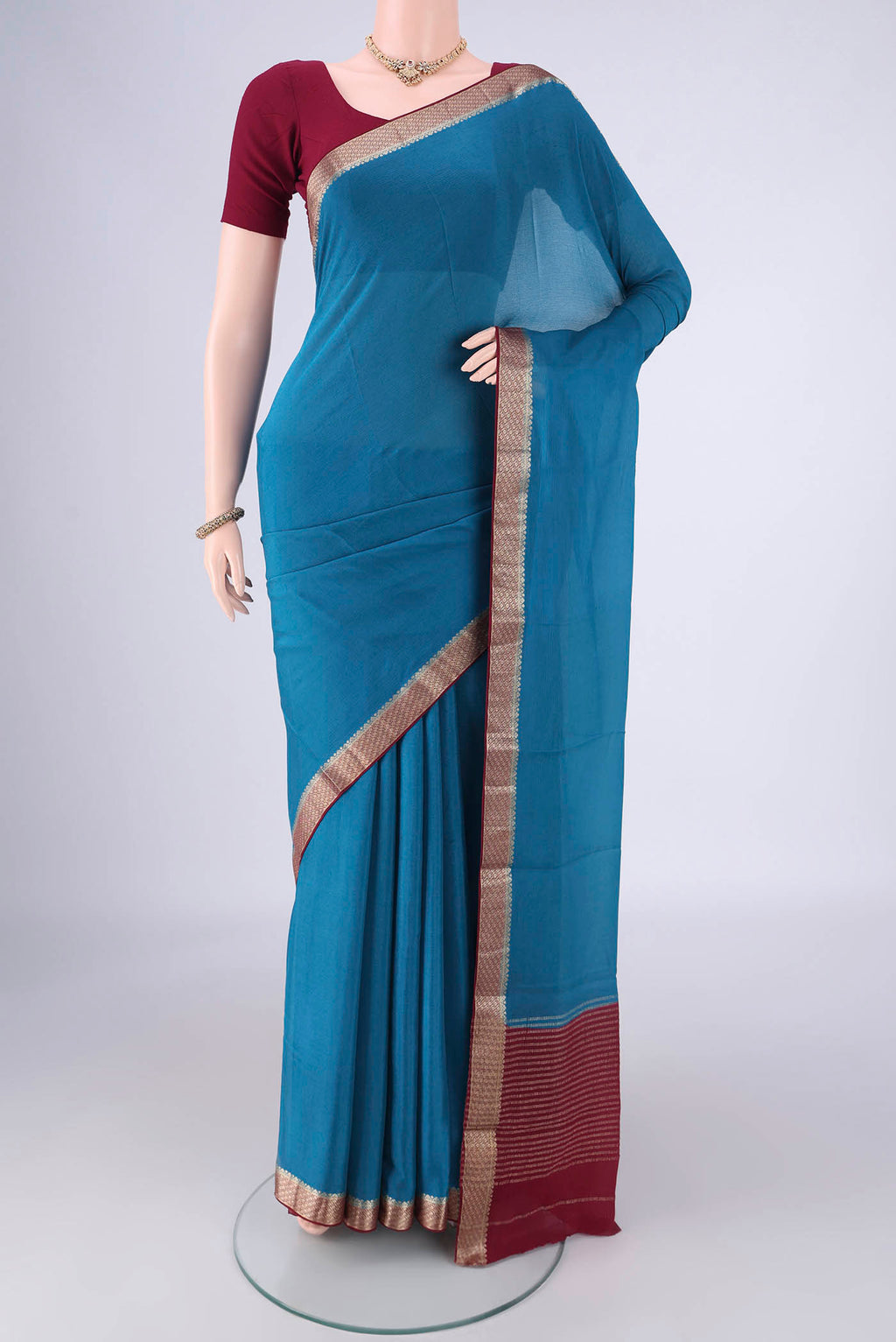 Blue Mysore Chiffon Saree with Plain Body and Zari Border.  displayed on a mannequin