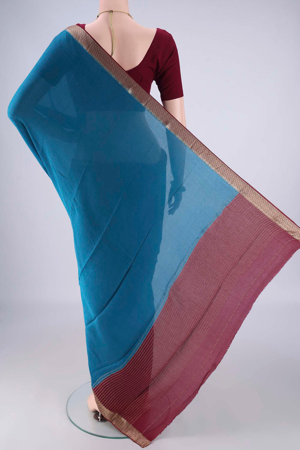 Flat view of Blue Mysore Chiffon Saree with Plain Body and Zari Border. 