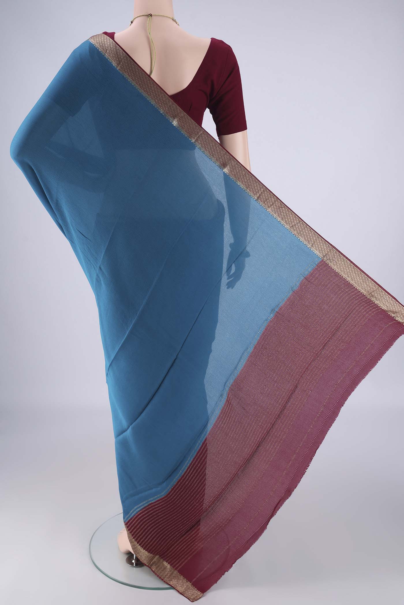 Flat view of Blue Mysore Chiffon Saree with Plain Body and Zari Border. 