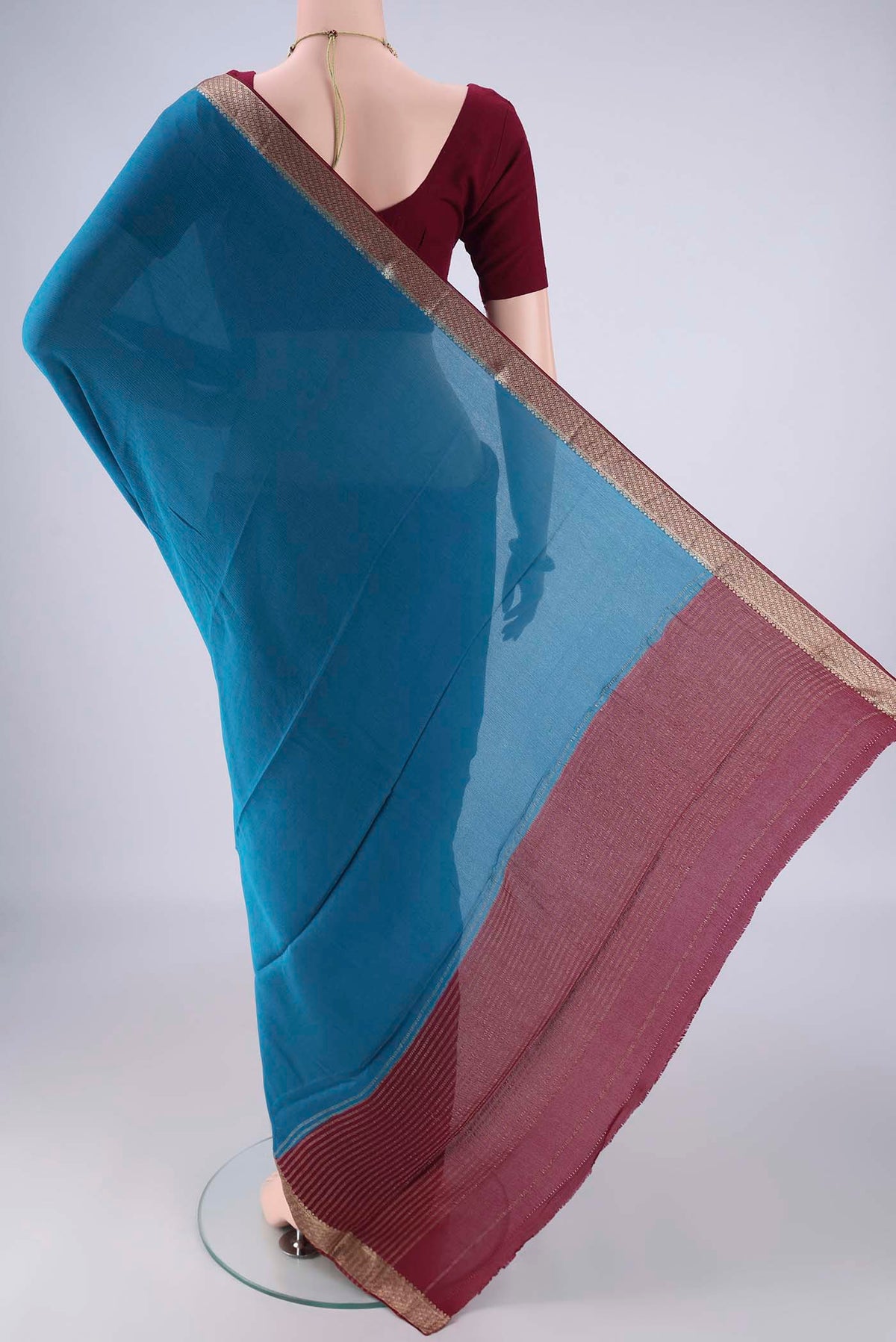 Flat view of Blue Mysore Chiffon Saree with Plain Body and Zari Border. 