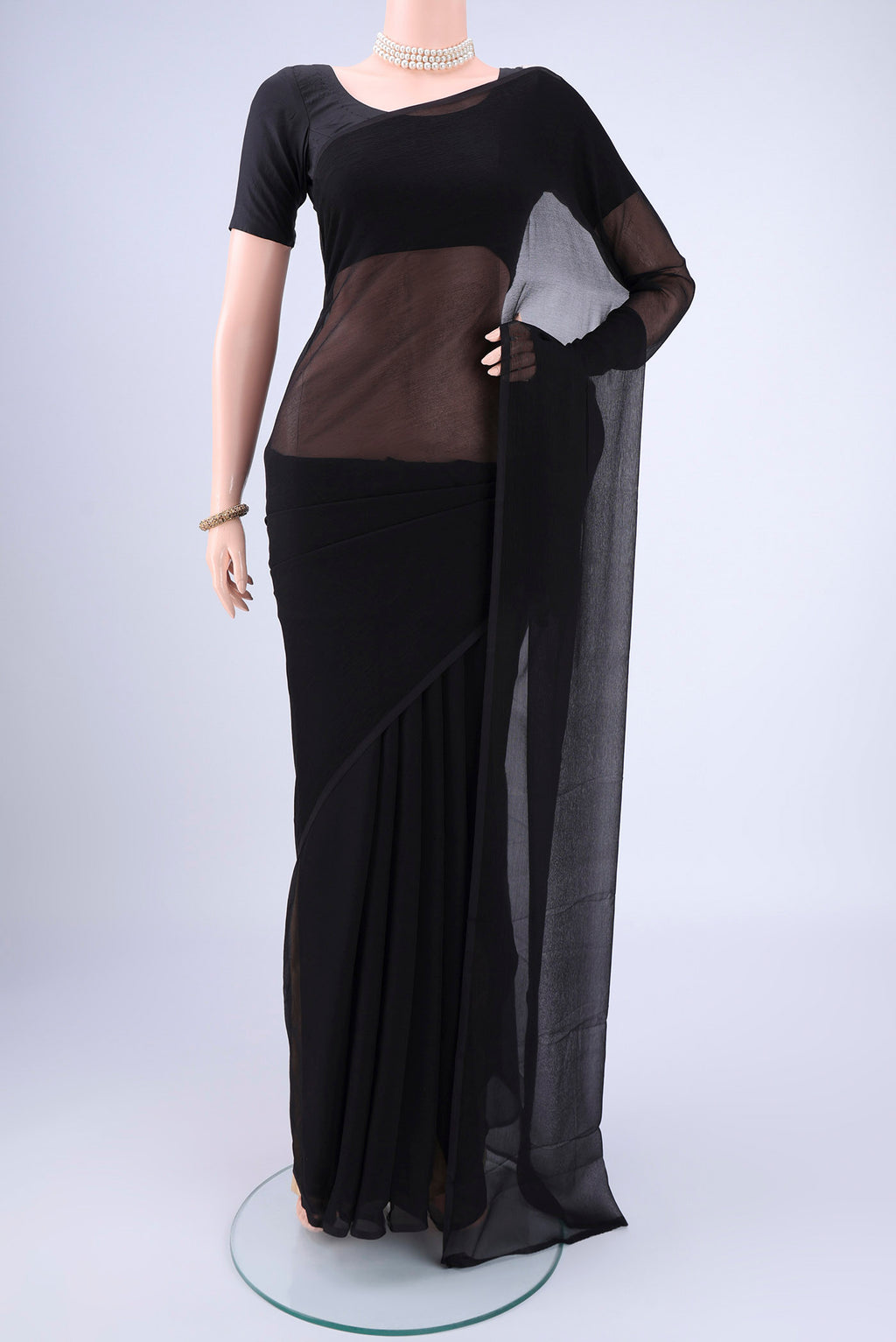 Black Mysore Chiffon Saree with Plain Body and Plain Border.  displayed on a mannequin
