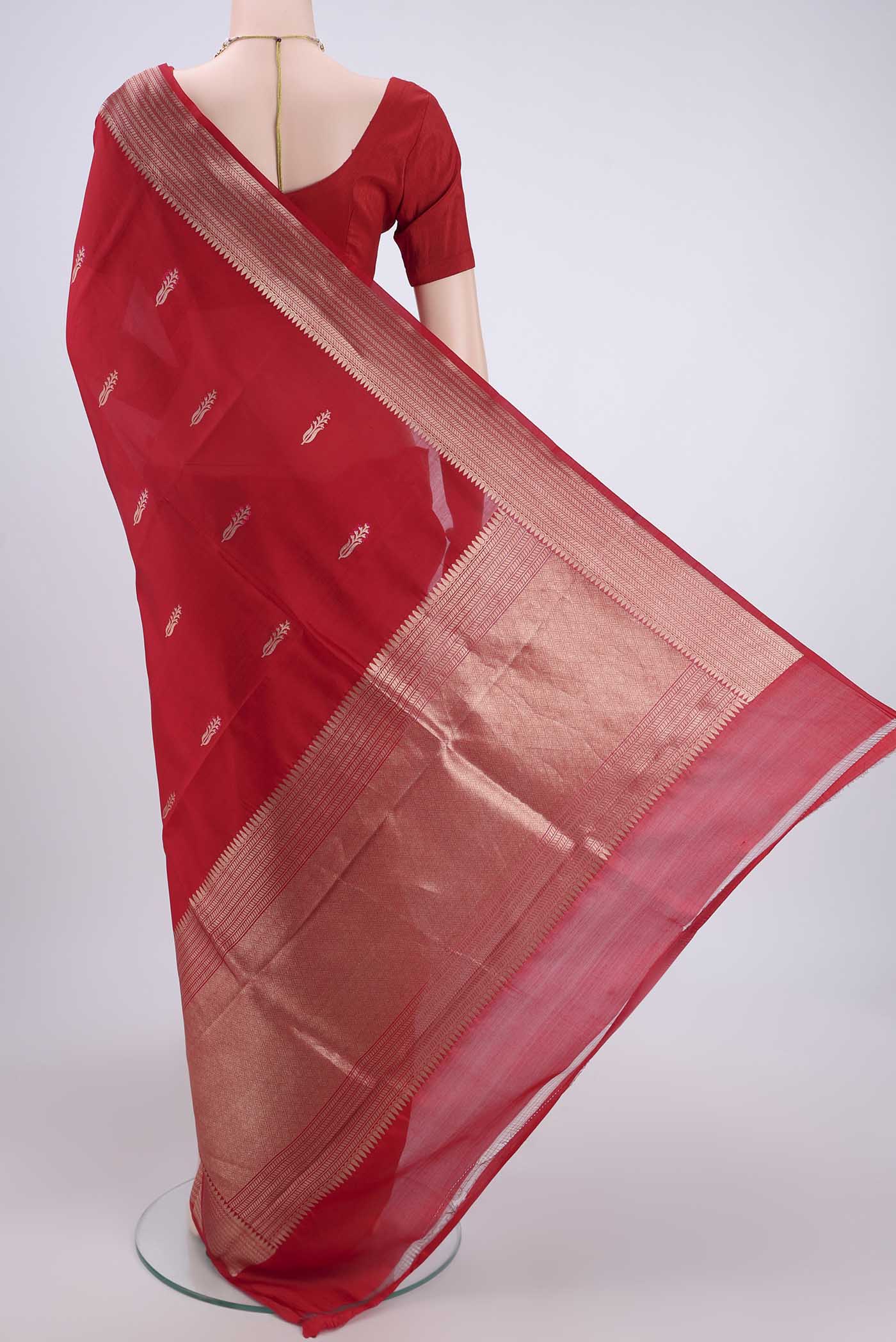 Flat view of Deep Red Banarasi Katan Silk Saree with Zari Butta on the body and Zari Border. 