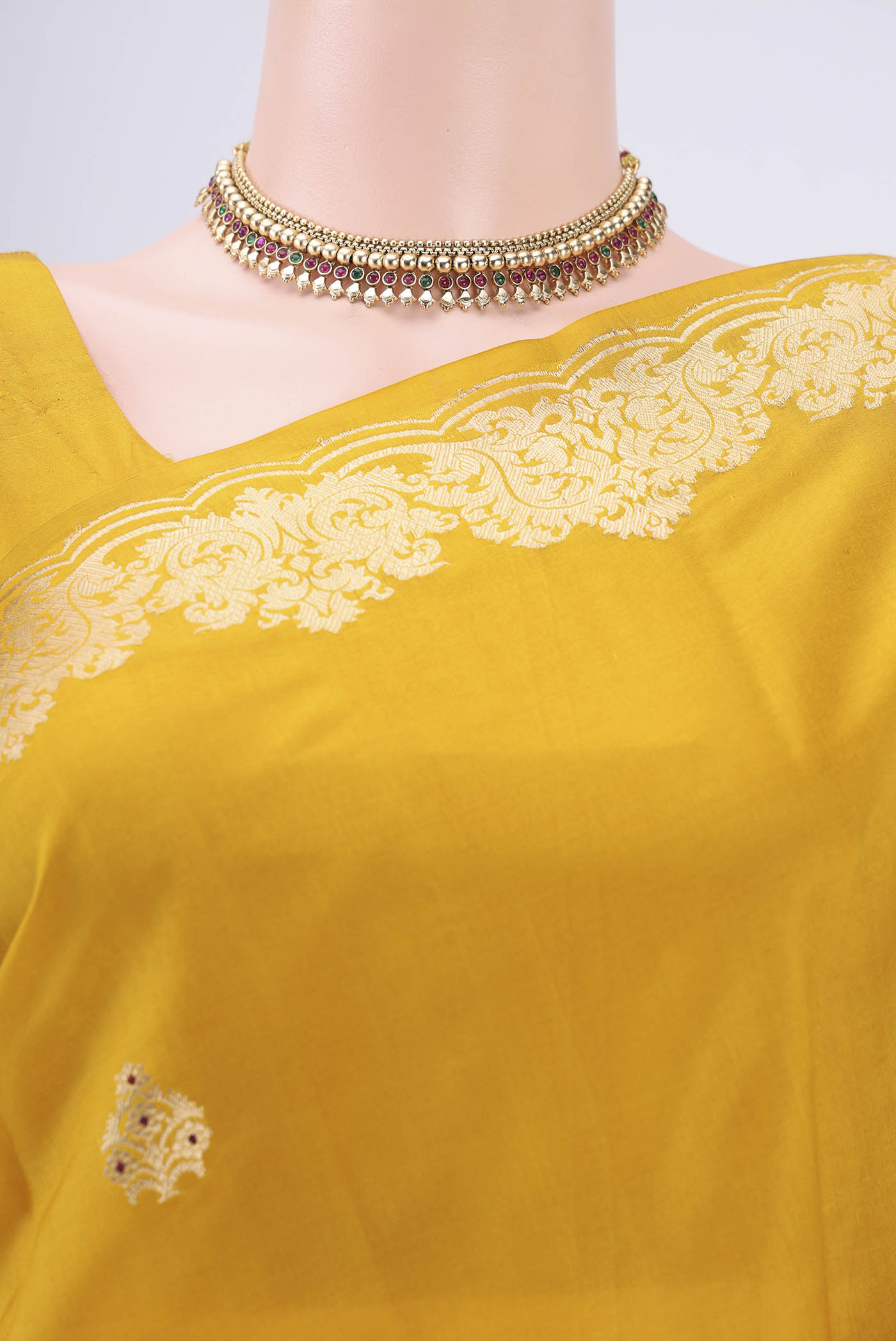 Border image of Yellow Banarasi Katan Silk Saree with Zari Butta on the body and Zari Border. 