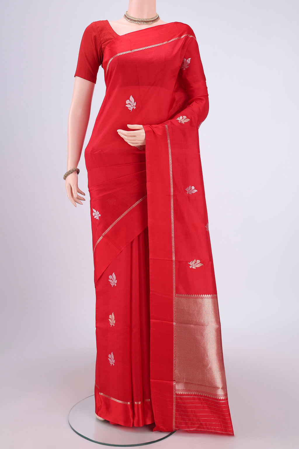 Red Banarasi Katan Silk Saree with Zari Butta on the body and Zari Border.  displayed on a mannequin