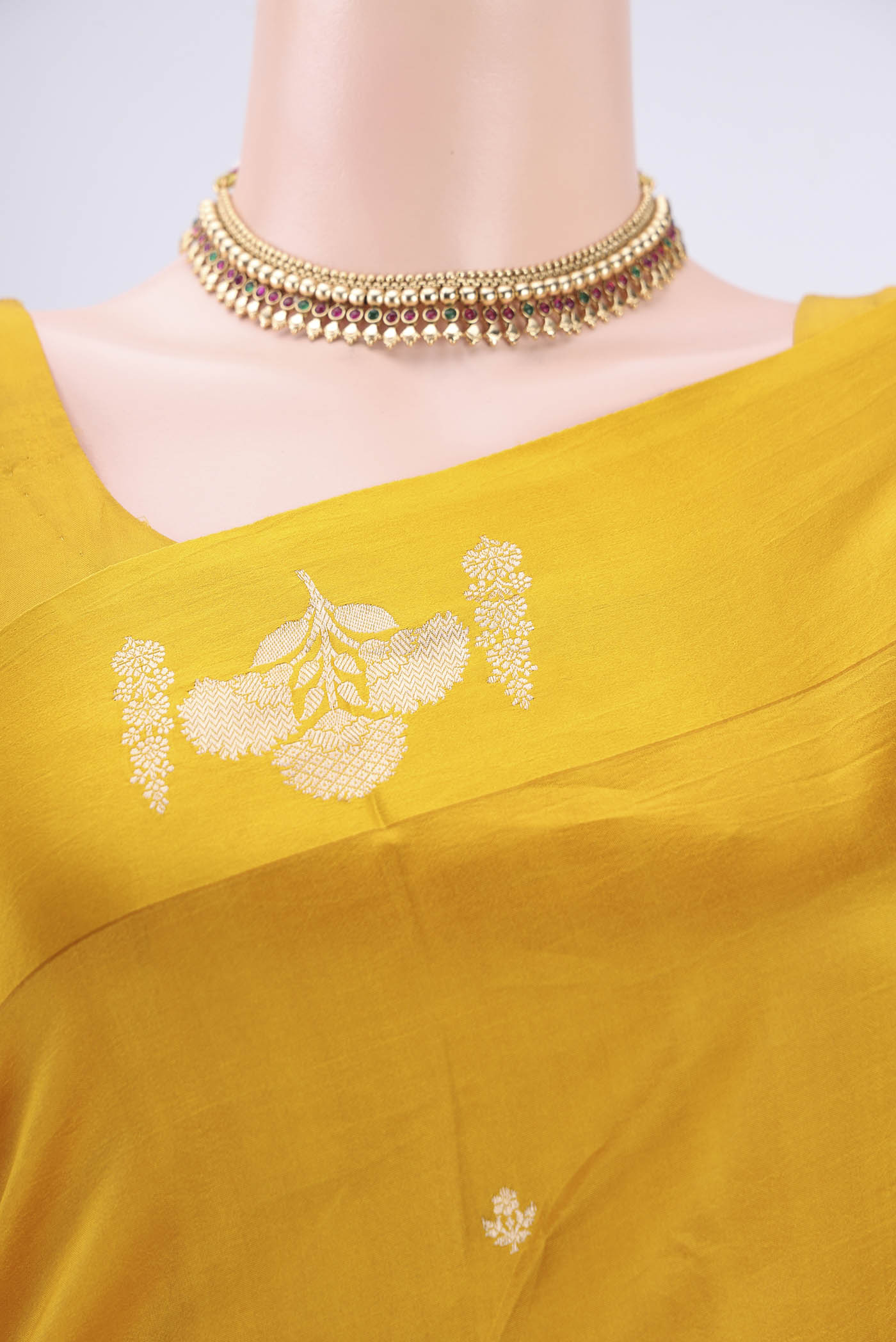 Border image of Yellow Banarasi Katan Silk Saree with Zari Butta on the body and Zari Border. 