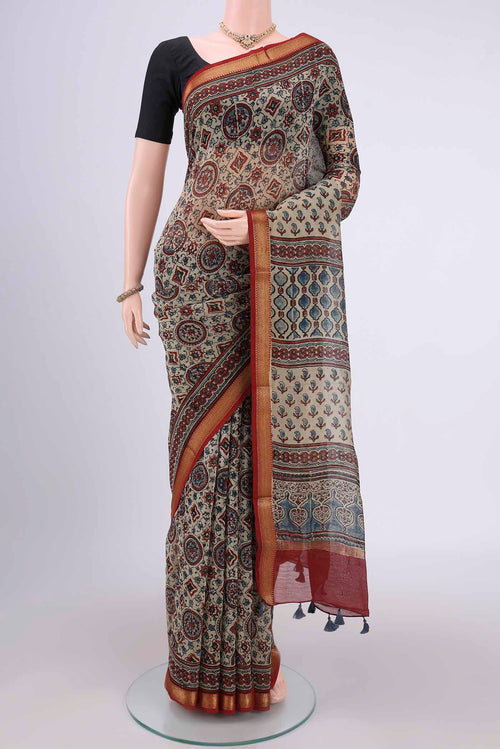Beige Chanderi Silk Cotton Saree with Ajrakh Print on the body and Zari Border.  displayed on a mannequin