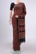 Maroon Chanderi Silk Cotton Saree with Ajrakh Print on the body and Zari Border.  displayed on a mannequin