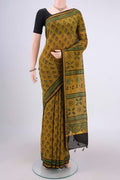 Yellow Chanderi Silk Cotton Saree with Ajrakh Print on the body and Zari Border.  displayed on a mannequin