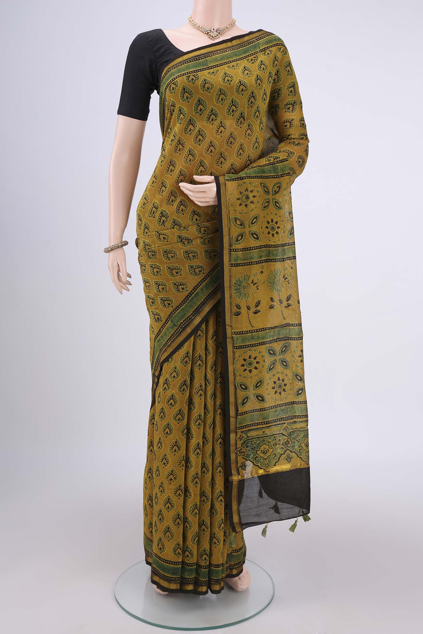 Yellow Chanderi Silk Cotton Saree with Ajrakh Print on the body and Zari Border.  displayed on a mannequin