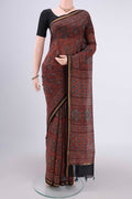 Maroon Chanderi Silk Cotton Saree with Ajrakh Print on the body and Zari Border.  displayed on a mannequin