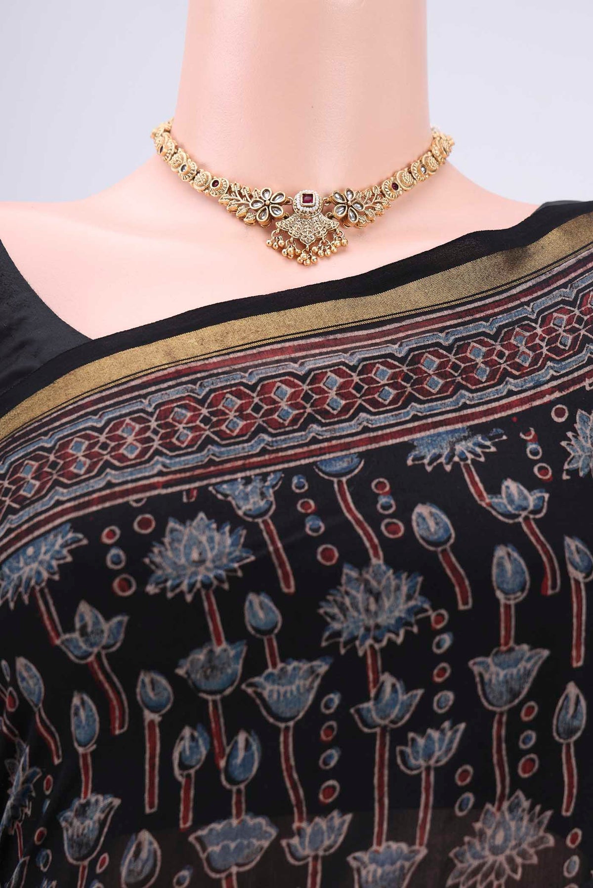 Border image of Black Chanderi Silk Cotton Saree with Ajrakh Print on the body and Zari Border. 