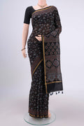 Black Chanderi Silk Cotton Saree with Ajrakh Print on the body and Zari Border.  displayed on a mannequin