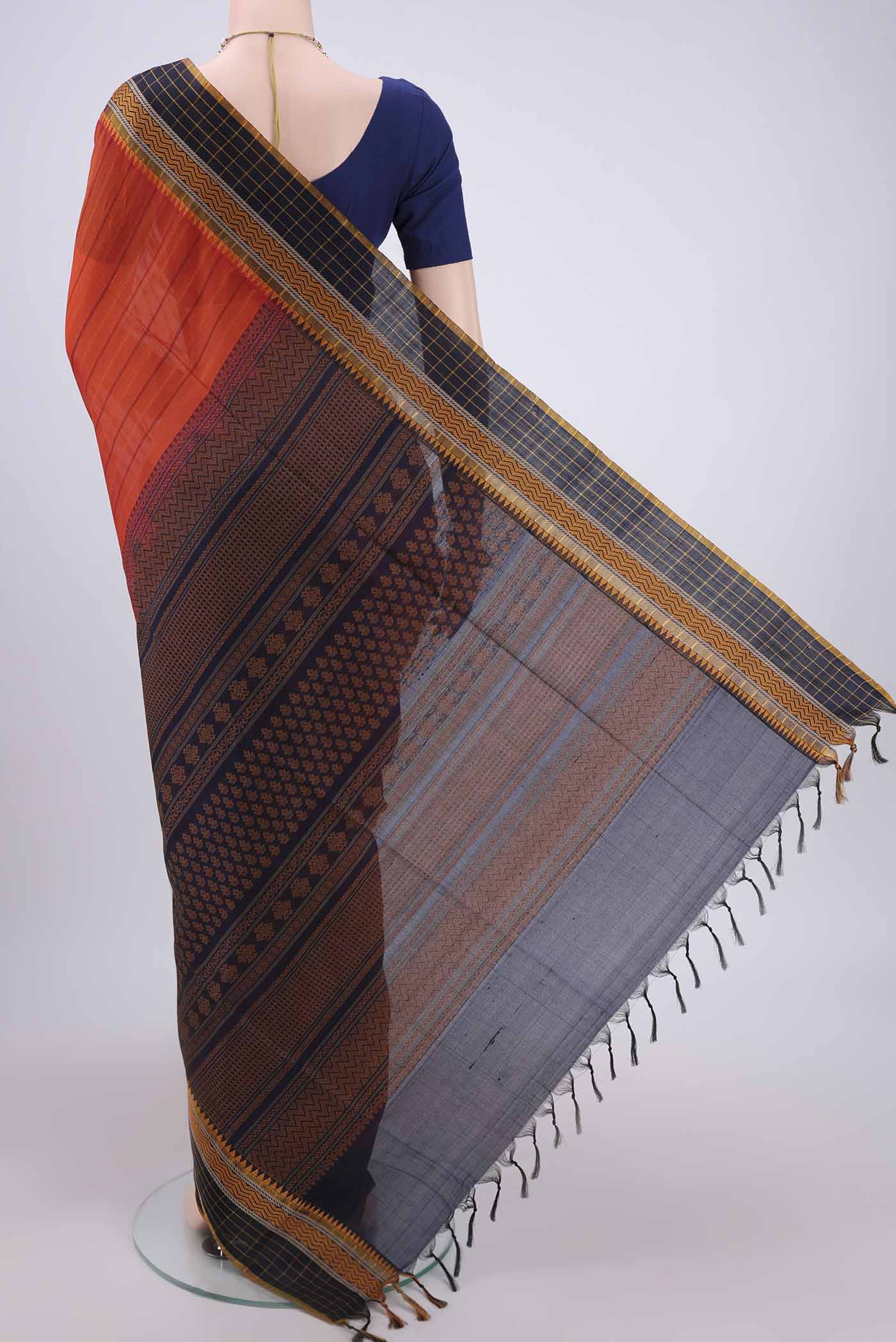 Flat view of Orange Silk Cotton Saree with Stripes on the body and Thread Border. 