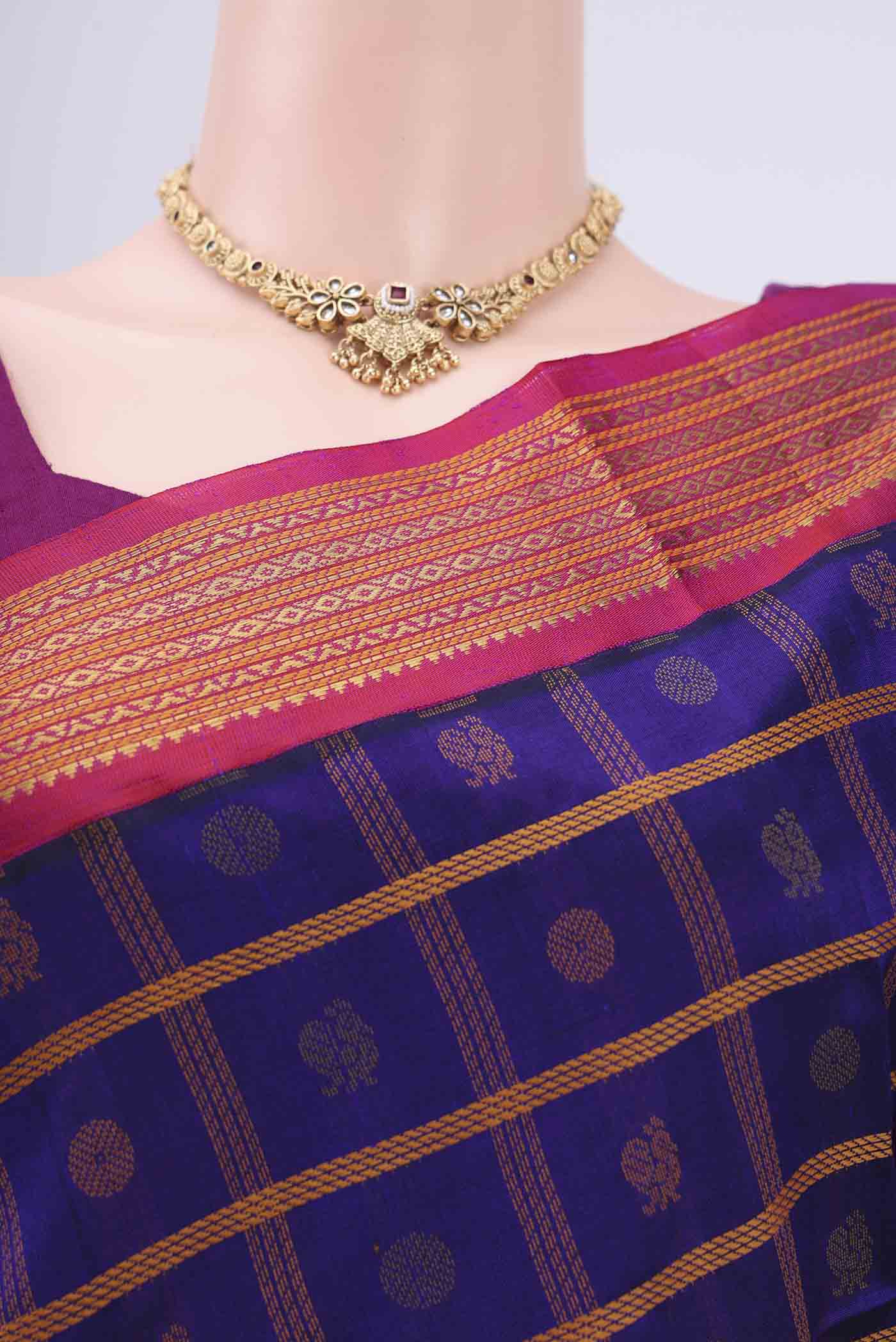 Border image of Purple Silk Cotton Saree with Checked design on the body and Plain Border. 