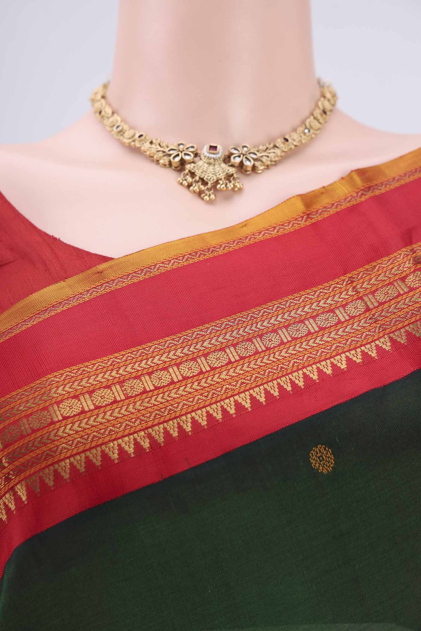 Border image of Red Coimbatore Silk Cotton Saree with Stripes on the body and Plain Border. 