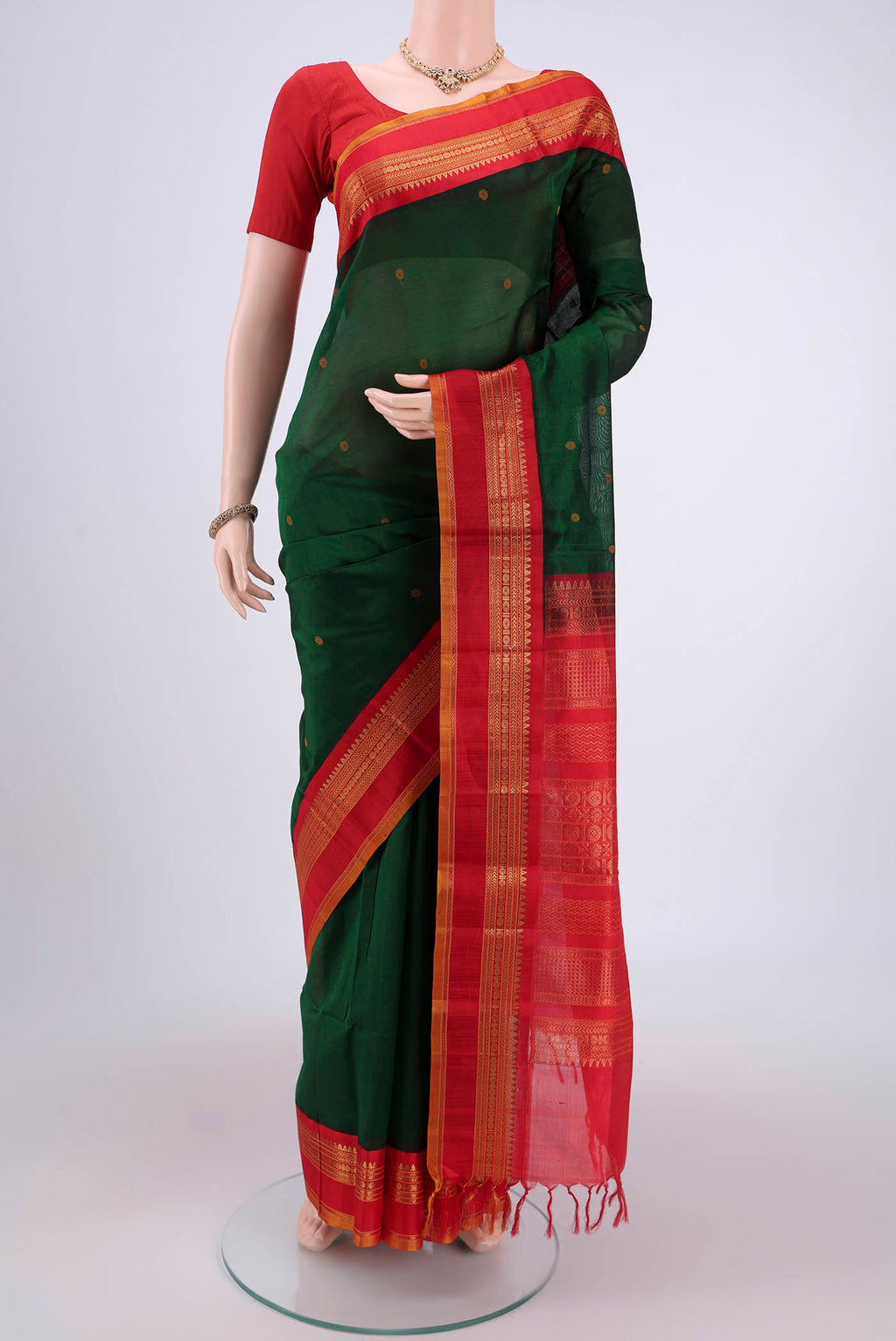 Red Coimbatore Silk Cotton Saree with Stripes on the body and Plain Border.  displayed on a mannequin