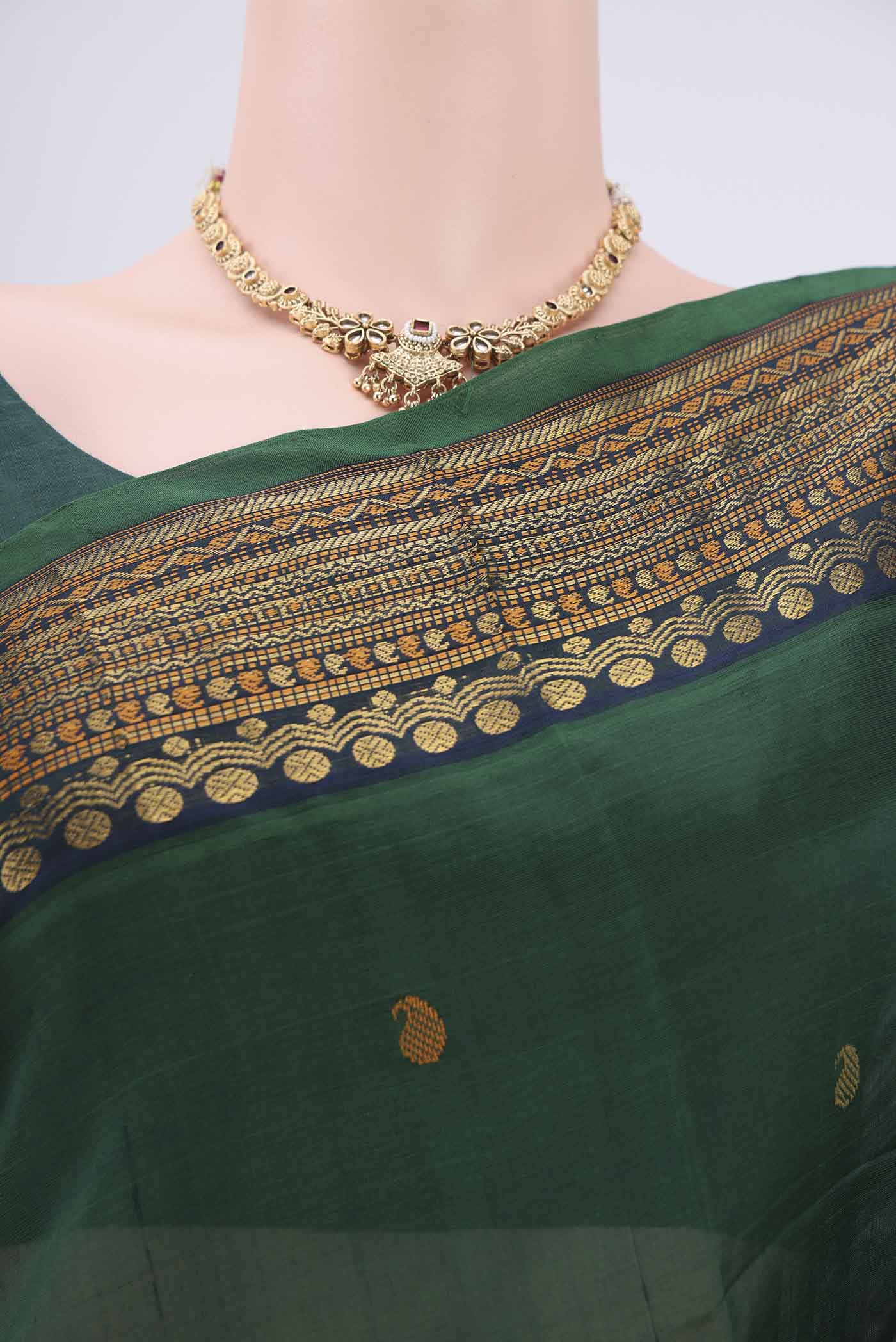 Border image of Bottle Green Coimbatore Silk Cotton Saree with Zari Butta on the body and Plain Border. 