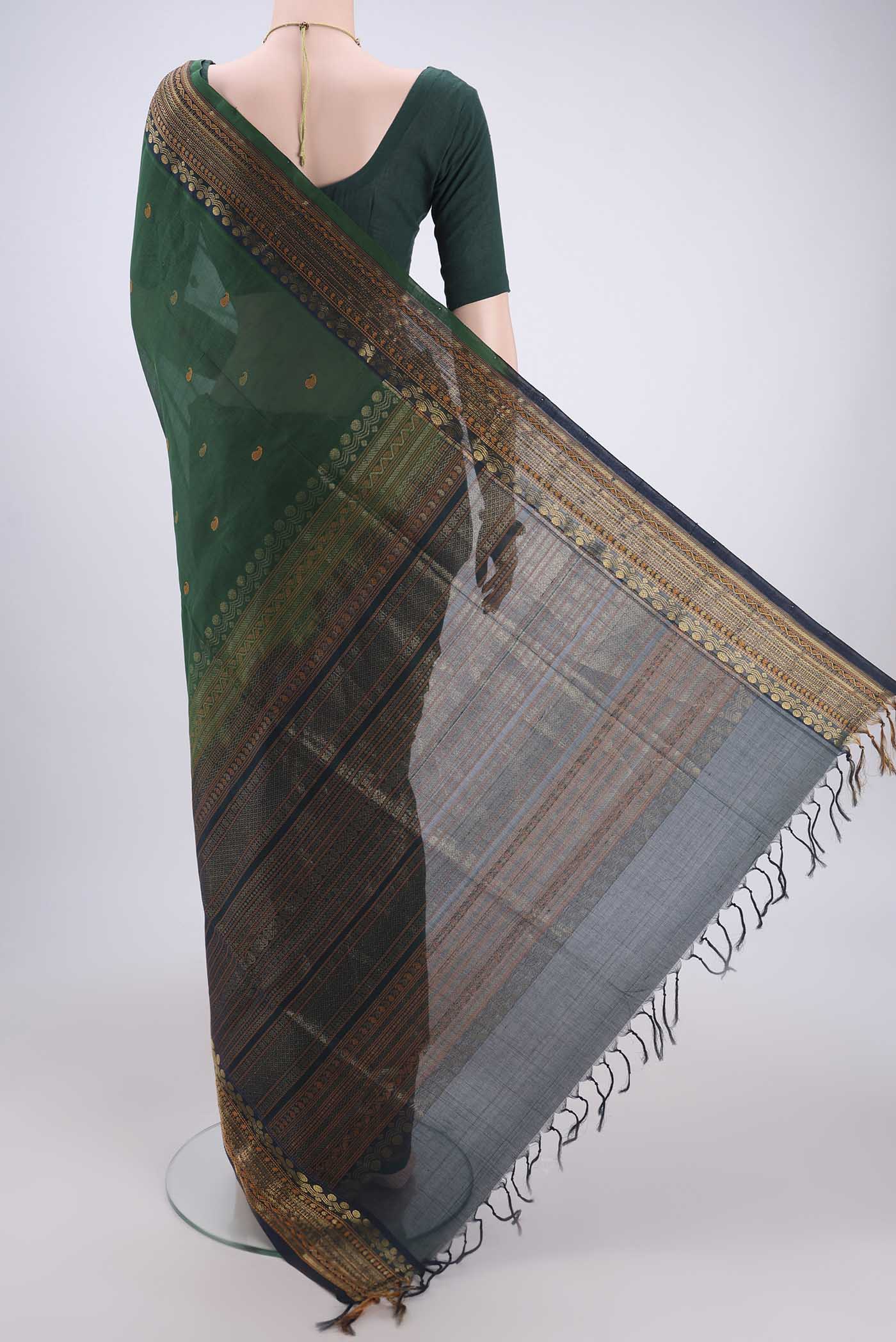 Flat view of Bottle Green Coimbatore Silk Cotton Saree with Zari Butta on the body and Plain Border. 