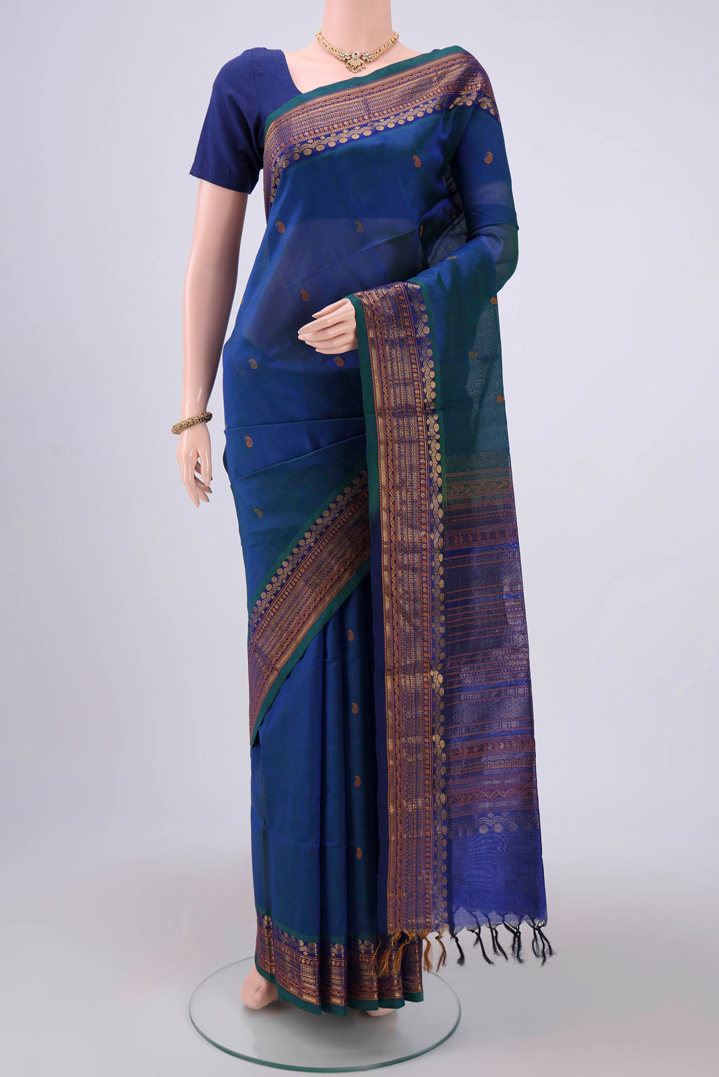 Turquoise Coimbatore Silk Cotton Saree with Stripes on the body and Plain Border.  displayed on a mannequin