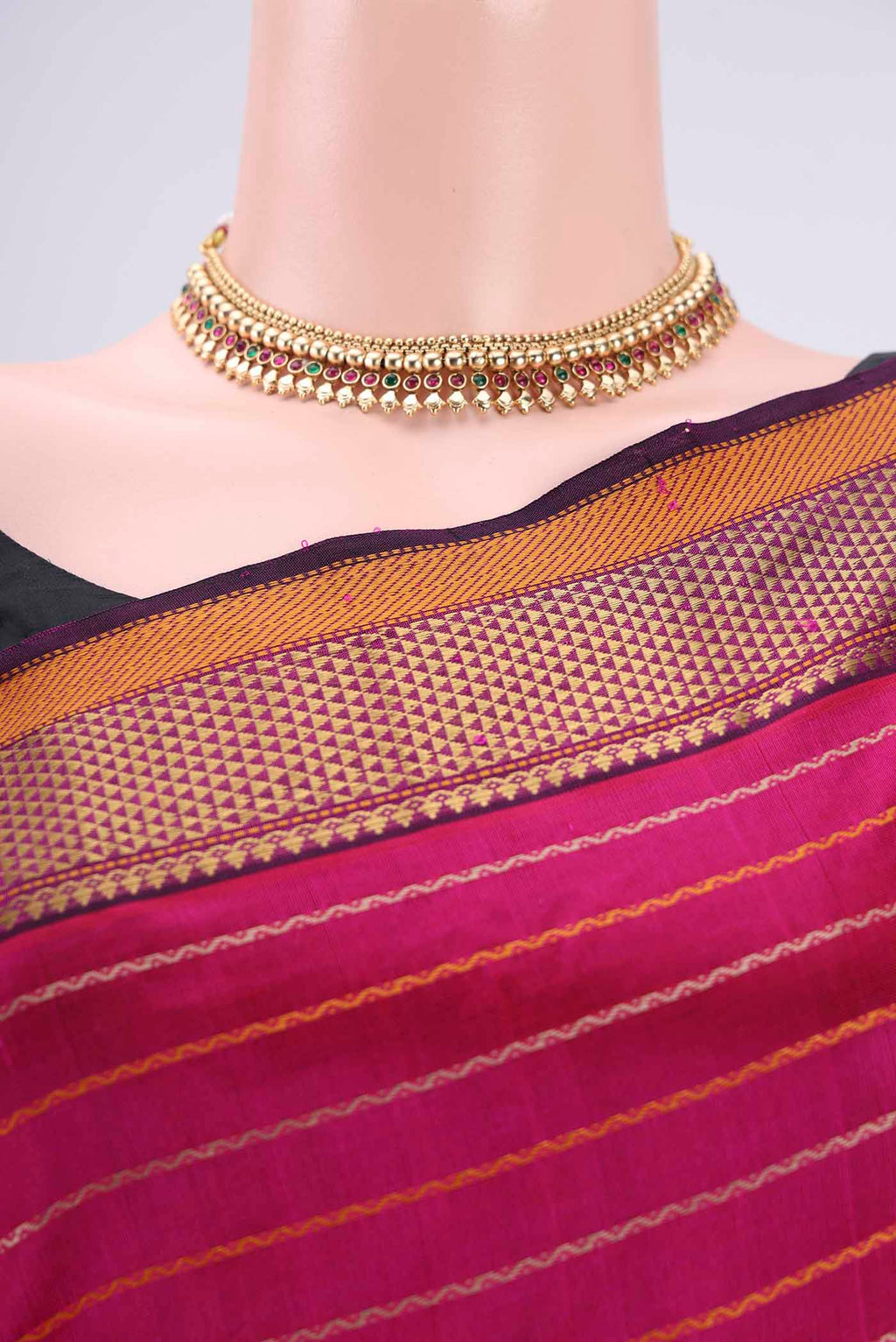 Border image of Rani Pink Silk Cotton Saree with Veldhari on the body and Zari Border. 