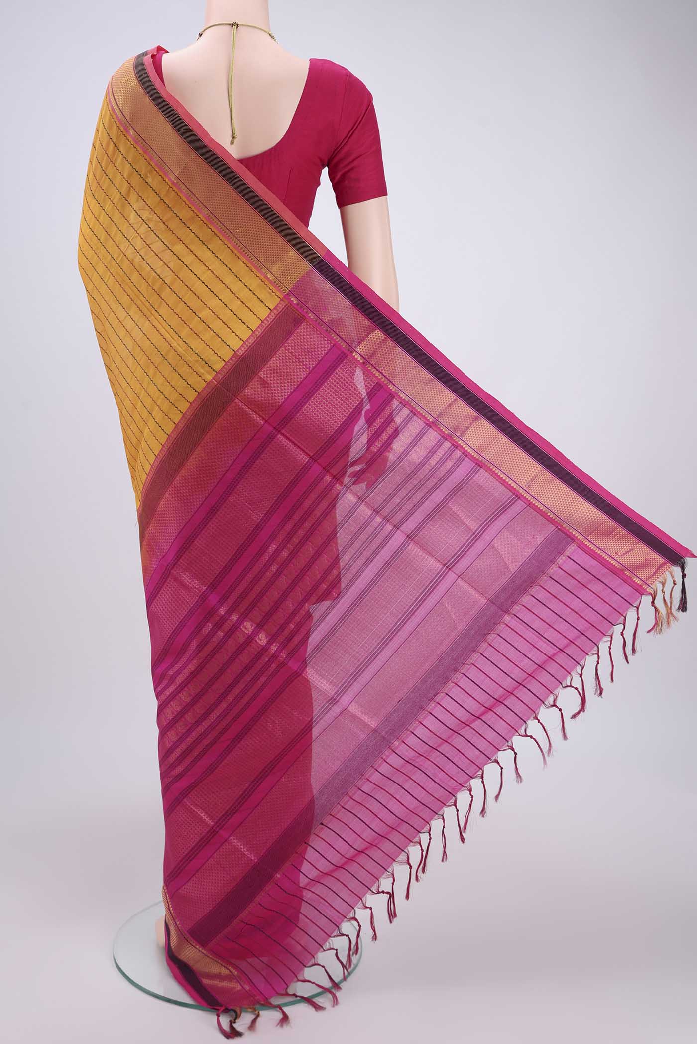 Flat view of Yellow Coimbatore Silk Cotton Saree with Stripes on the body and Plain Border. 