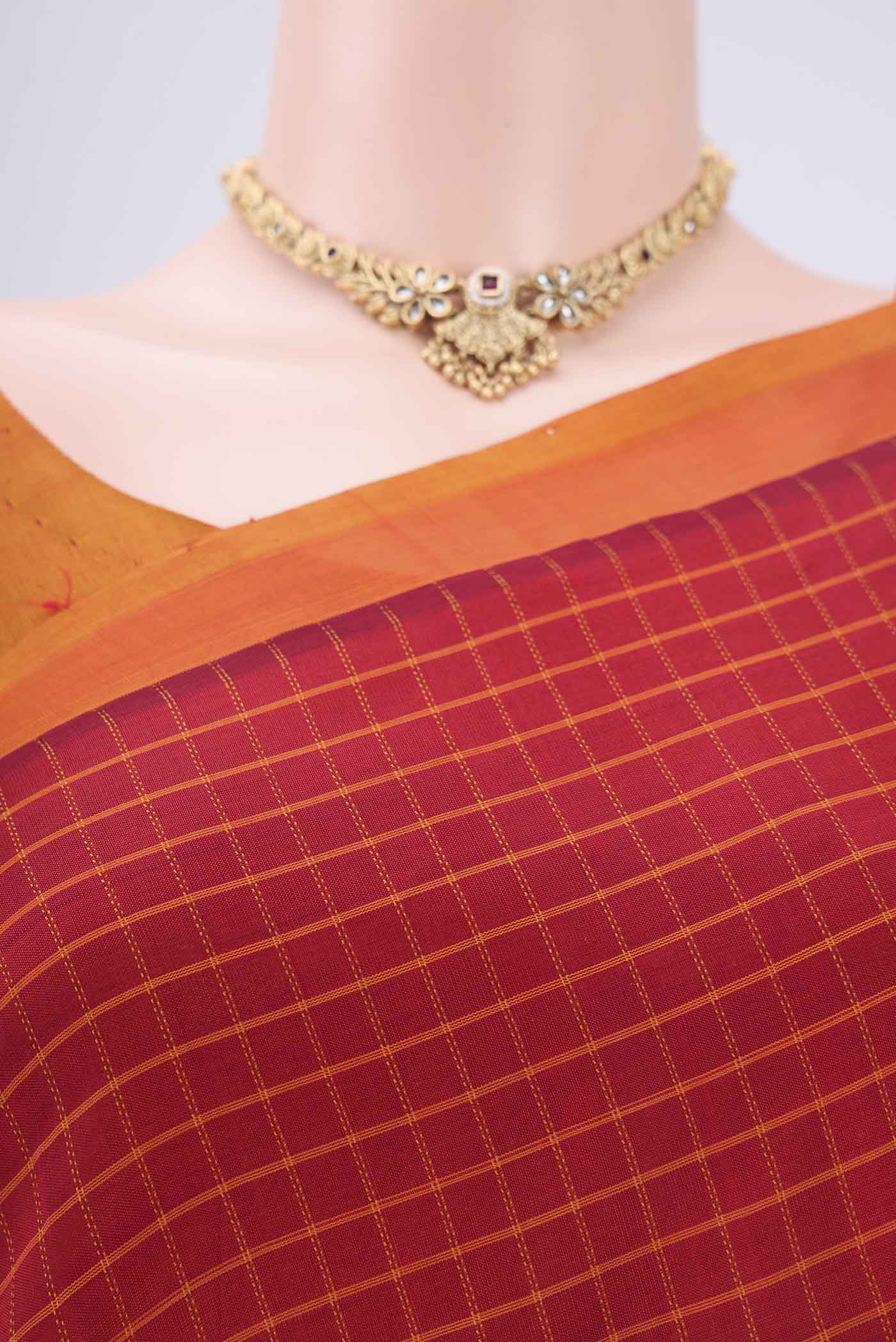 Border image of Red Coimbatore Silk Cotton Saree with Stripes on the body and Plain Border. 