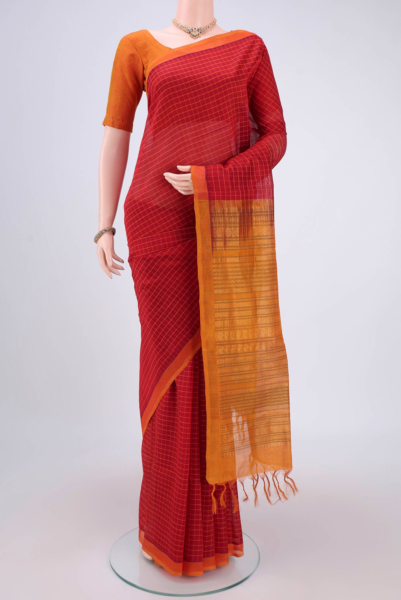 Red Coimbatore Silk Cotton Saree with Stripes on the body and Plain Border.  displayed on a mannequin