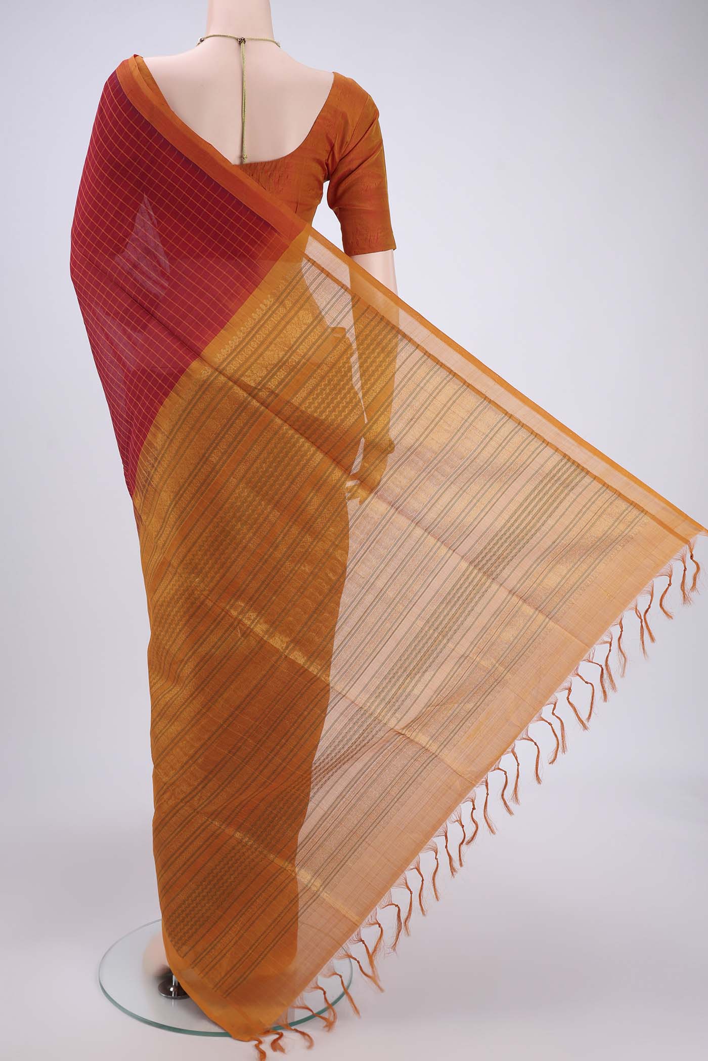 Flat view of Red Coimbatore Silk Cotton Saree with Stripes on the body and Plain Border. 