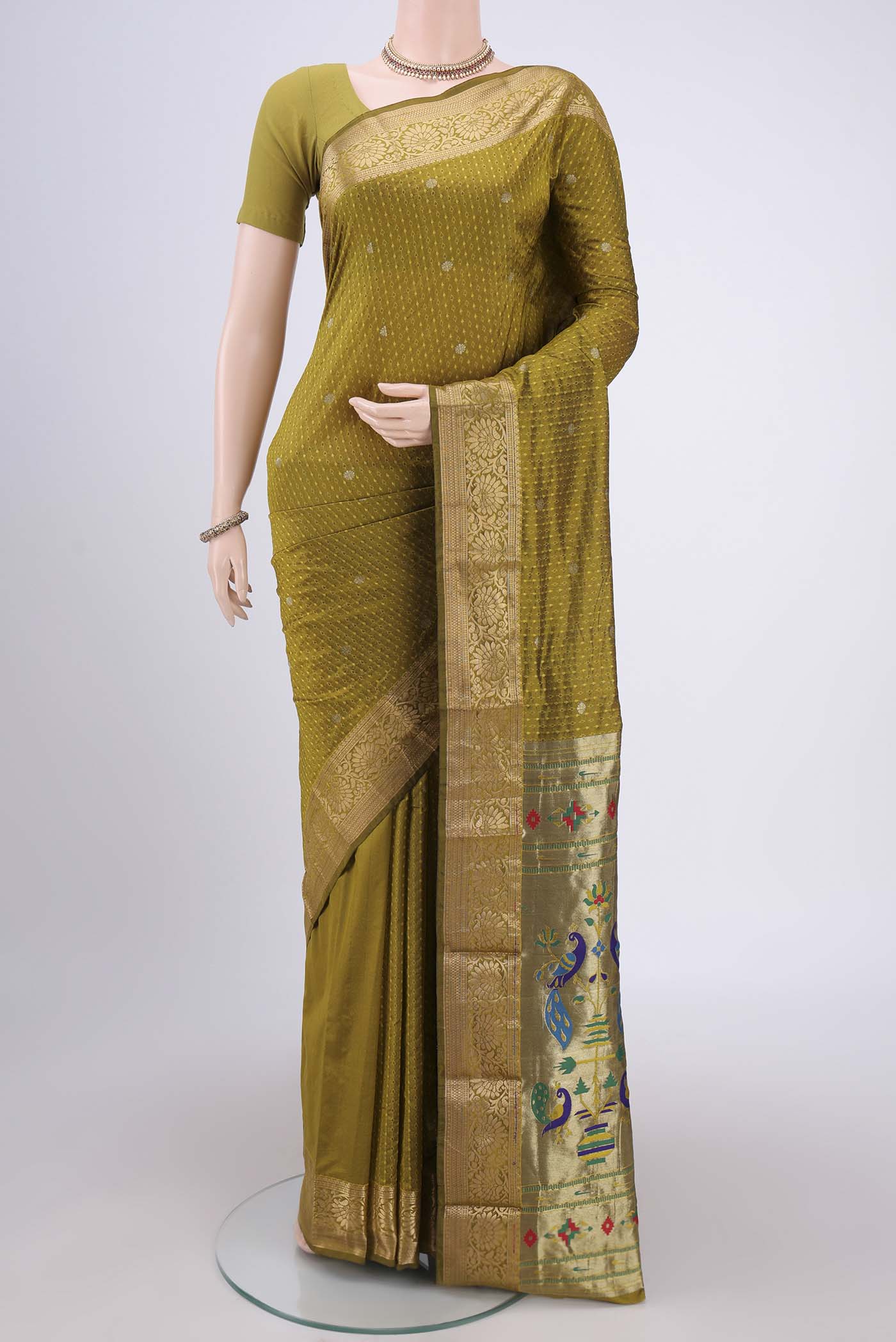 Mehandi Green Dual Tone Blended Bangalore Silk Saree with Jacquard With Zari Butta on the body and Zari Border.  displayed on a mannequin