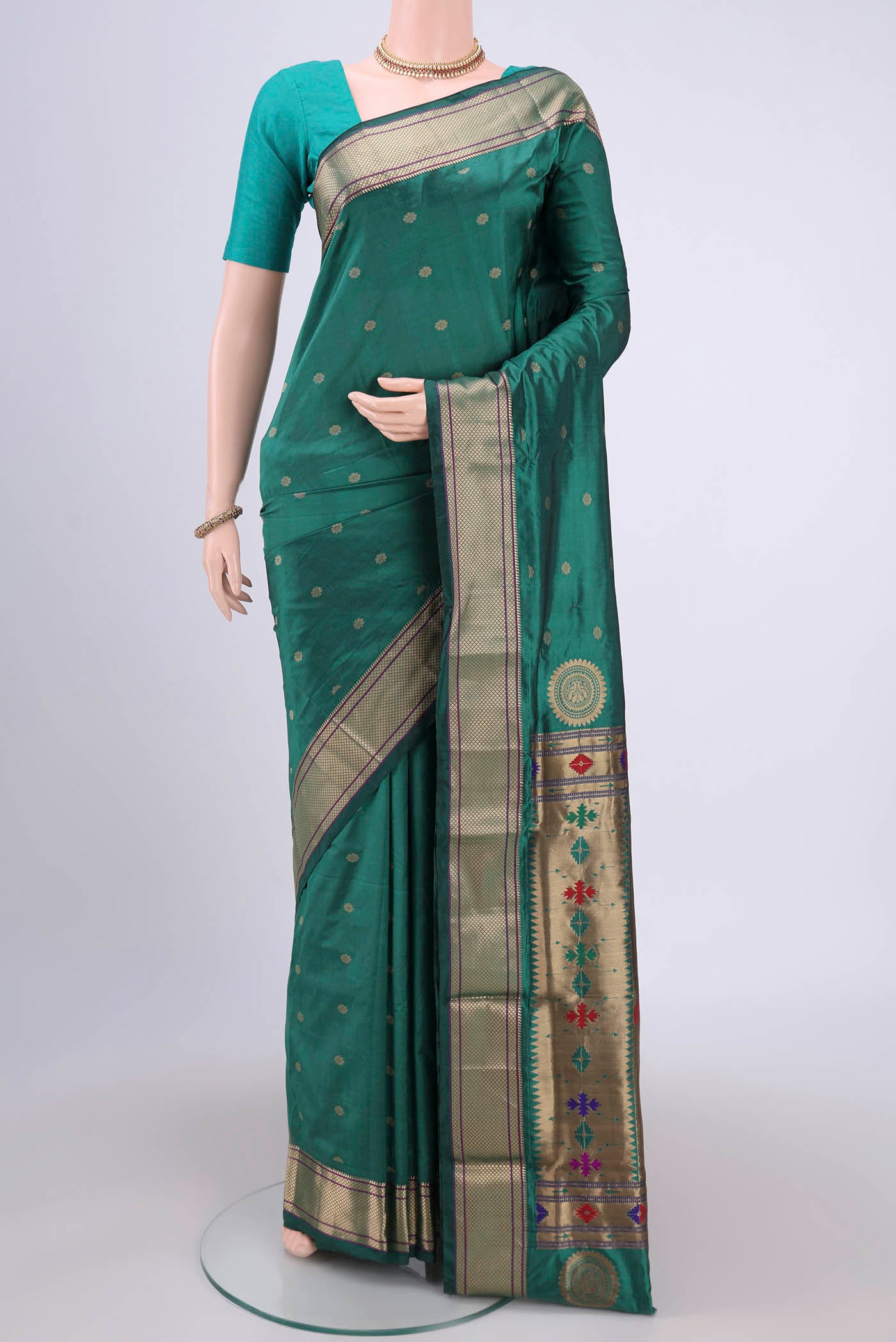Sea Green Blended Bangalore Silk Saree with Zari Butta on the body and Paithani Border.  displayed on a mannequin