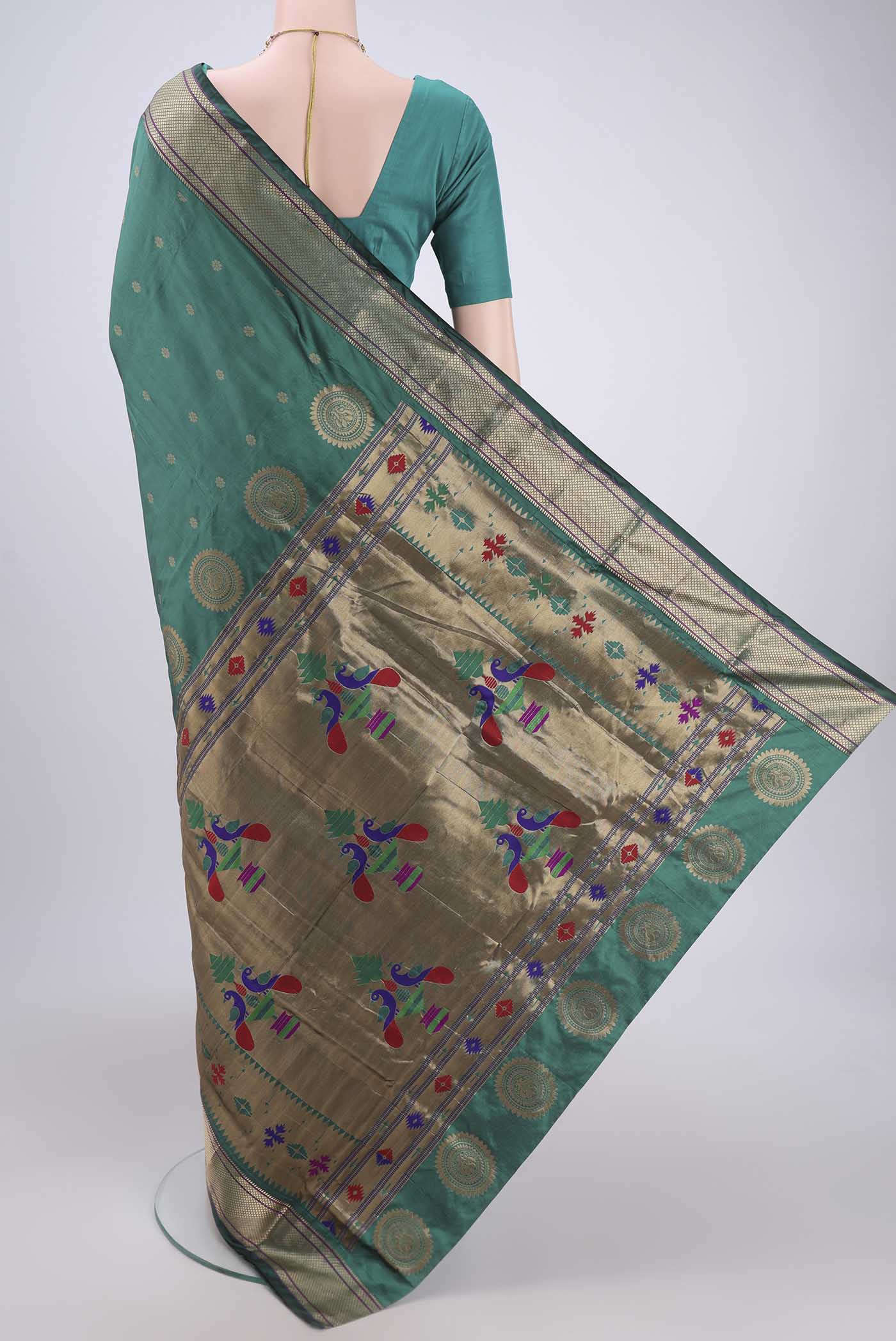 Flat view of Sea Green Blended Bangalore Silk Saree with Zari Butta on the body and Paithani Border. 
