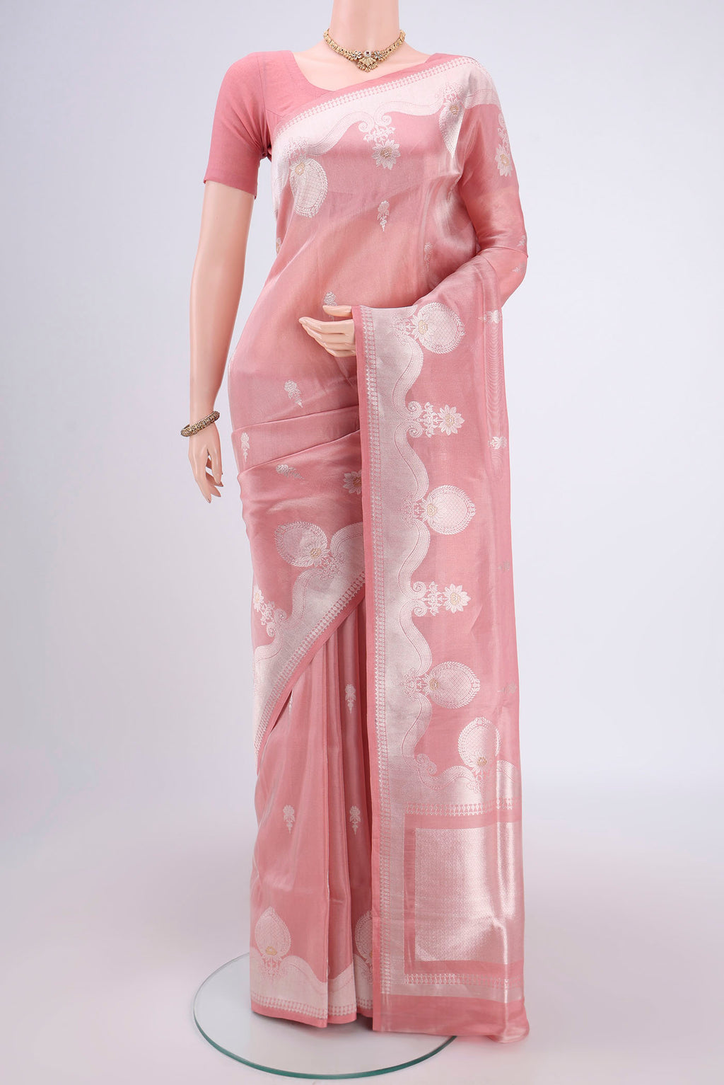 Peach Kora Silk Saree with Zari Brocade on the body and Zari Border.  displayed on a mannequin