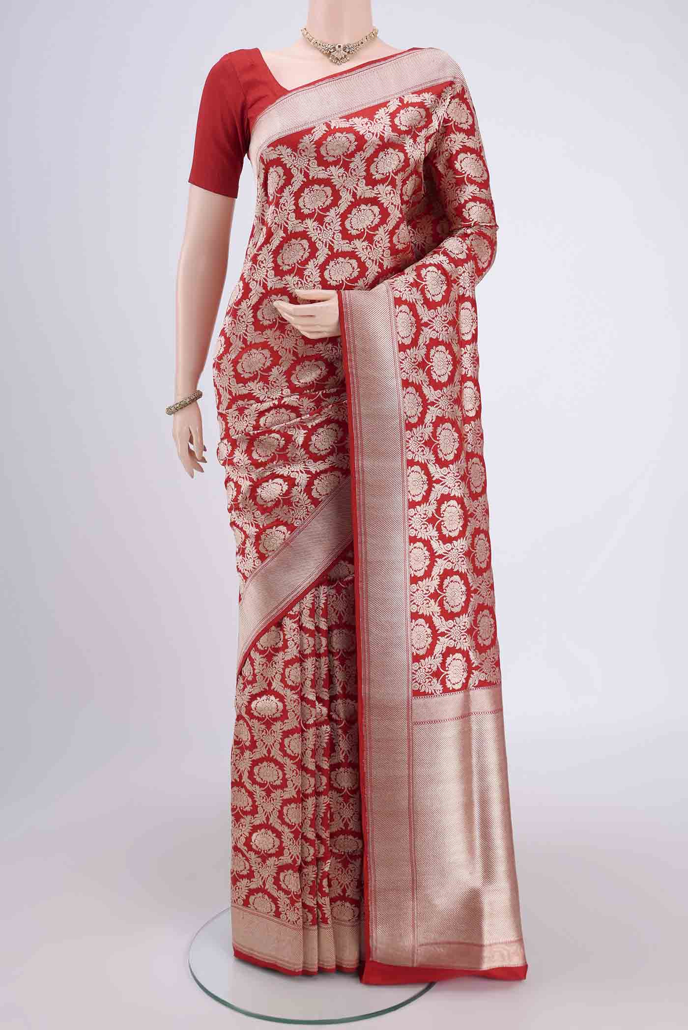 Red Kora Silk Saree with Zari Brocade on the body and Zari Border.  displayed on a mannequin