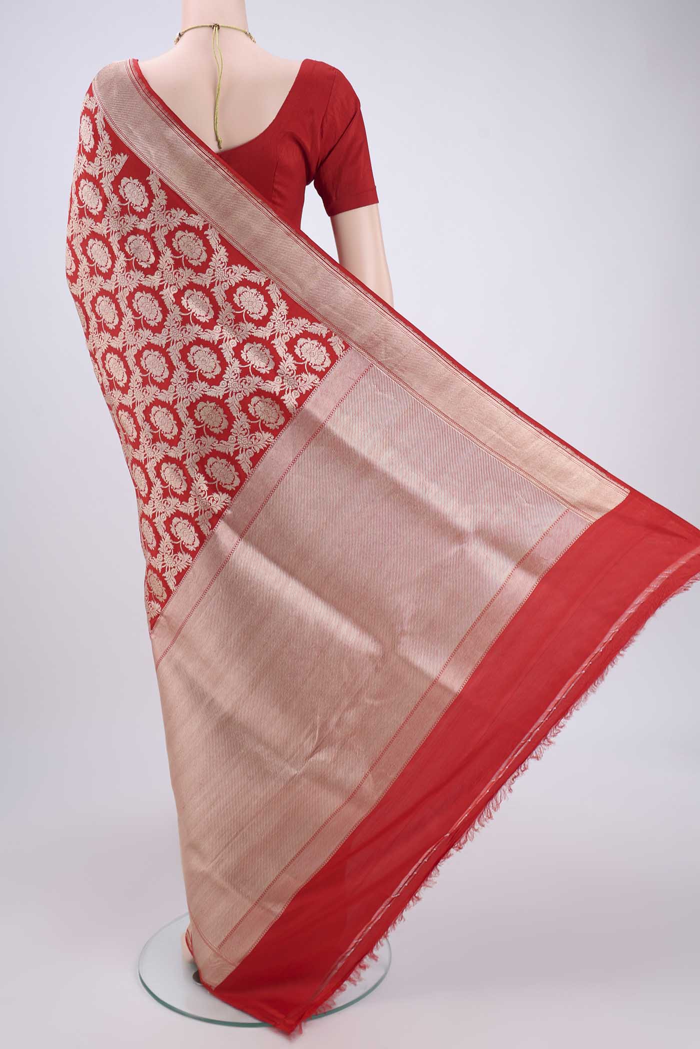 Flat view of Red Kora Silk Saree with Zari Brocade on the body and Zari Border. 