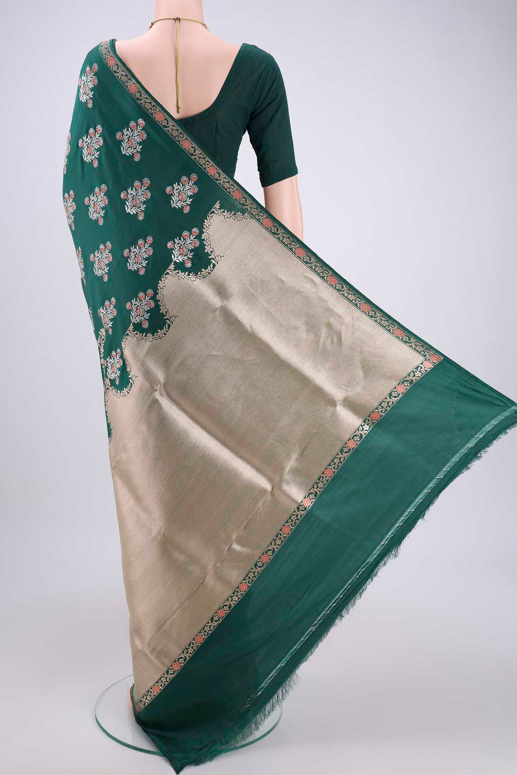 Flat view of Bottle Green Banarasi Saree with Zari Brocade on the body and Zari Border. 