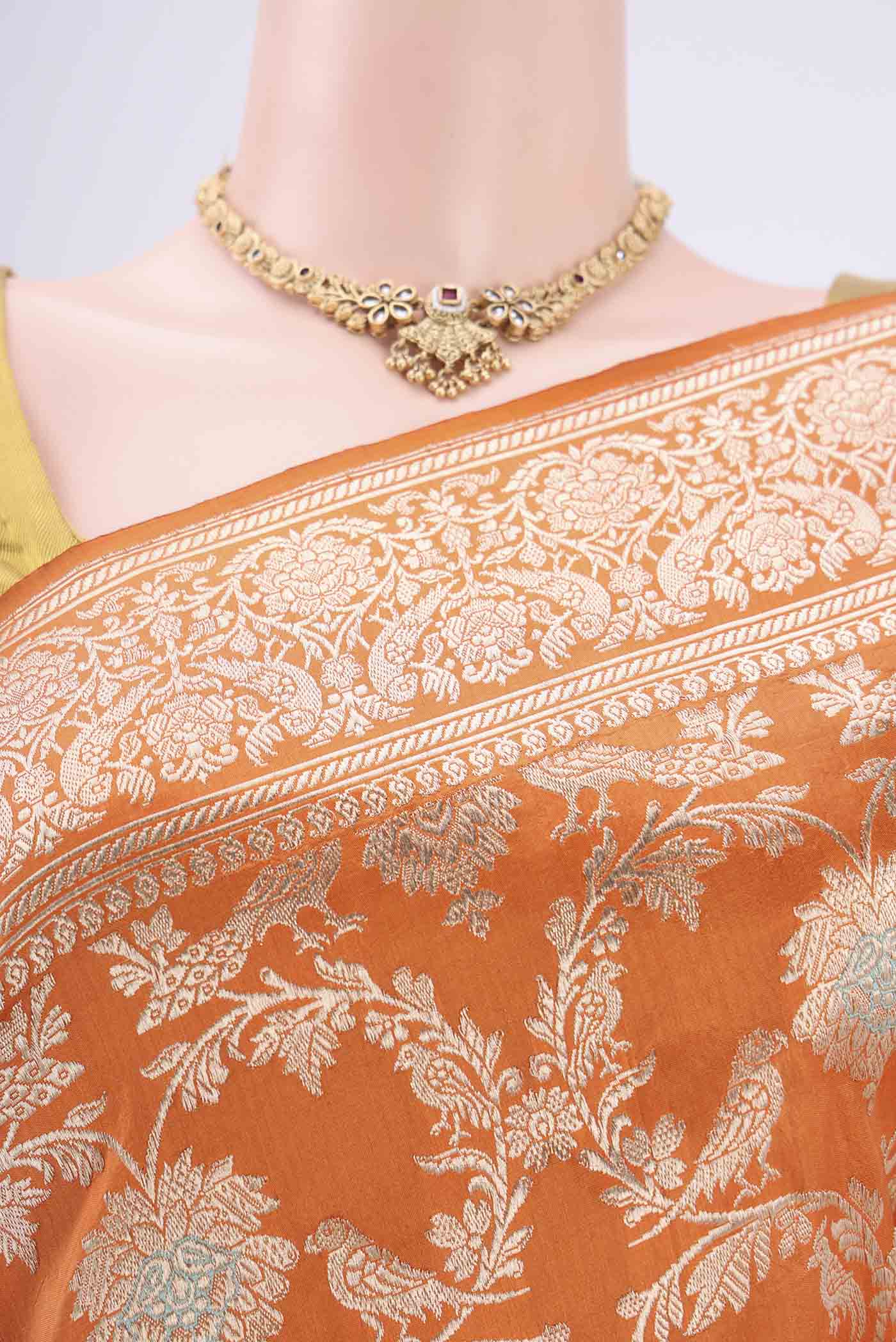 Border image of Orange Banarasi Saree with Zari Brocade on the body and Zari Border. 