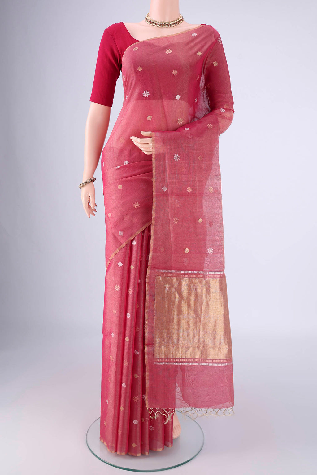 Rose pink Tussar Silk Saree with Zari Butta on the body and Plain Border.  displayed on a mannequin
