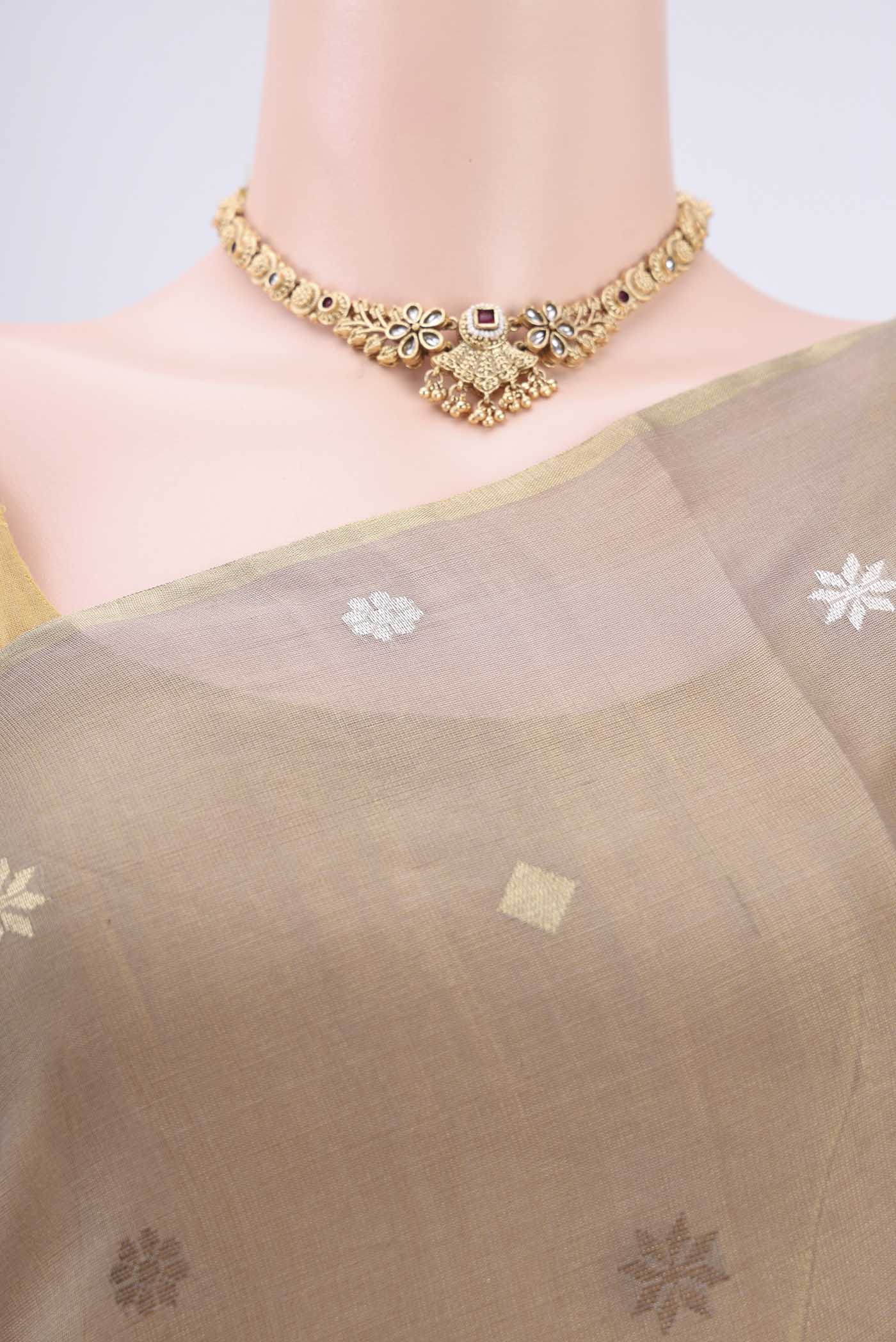 Border image of Beige MP Tussar Saree with Zari Butta on the body and Zari Border. 