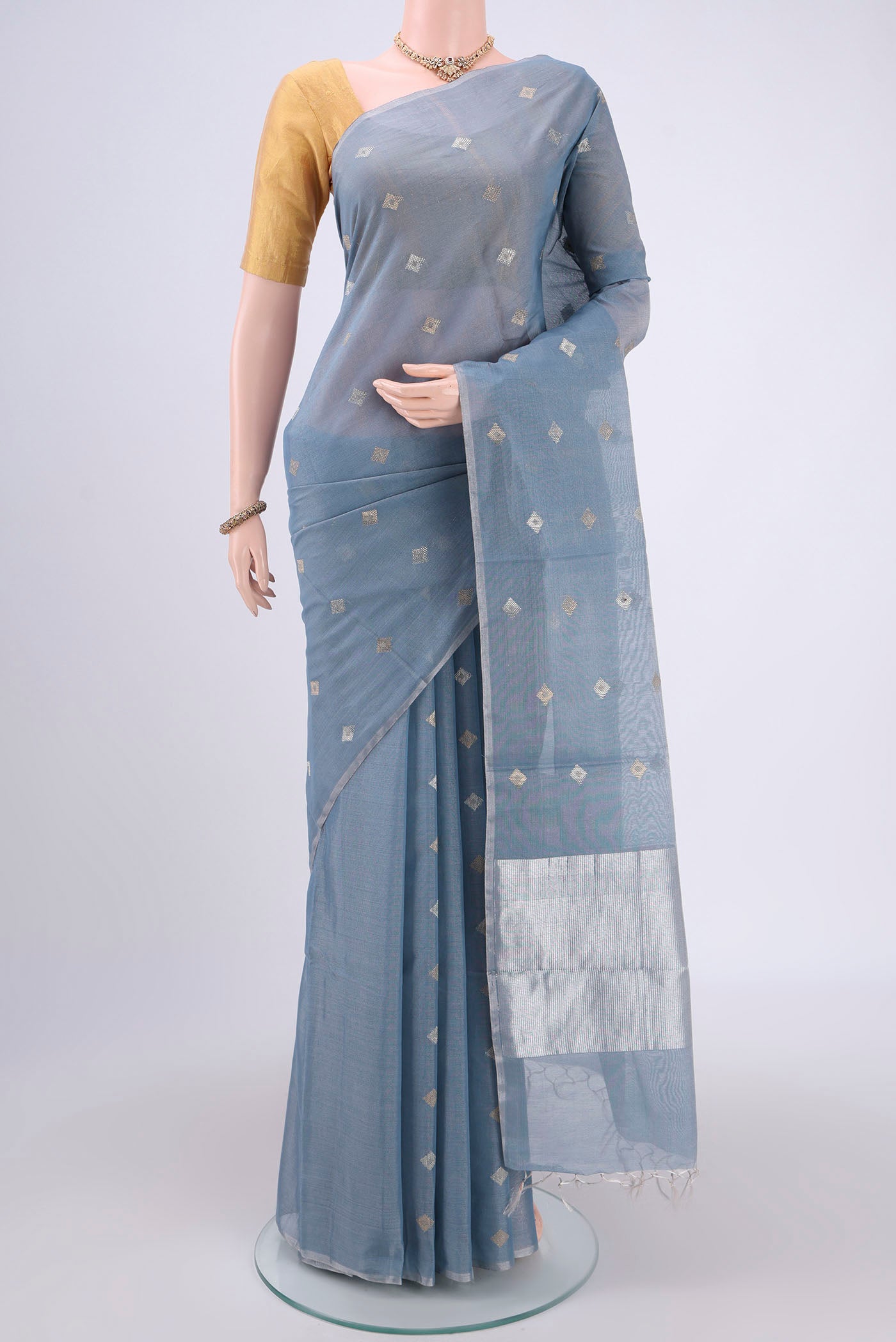 Sky Blue MP Tussar Saree with Zari Butta on the body and Zari Border.  displayed on a mannequin